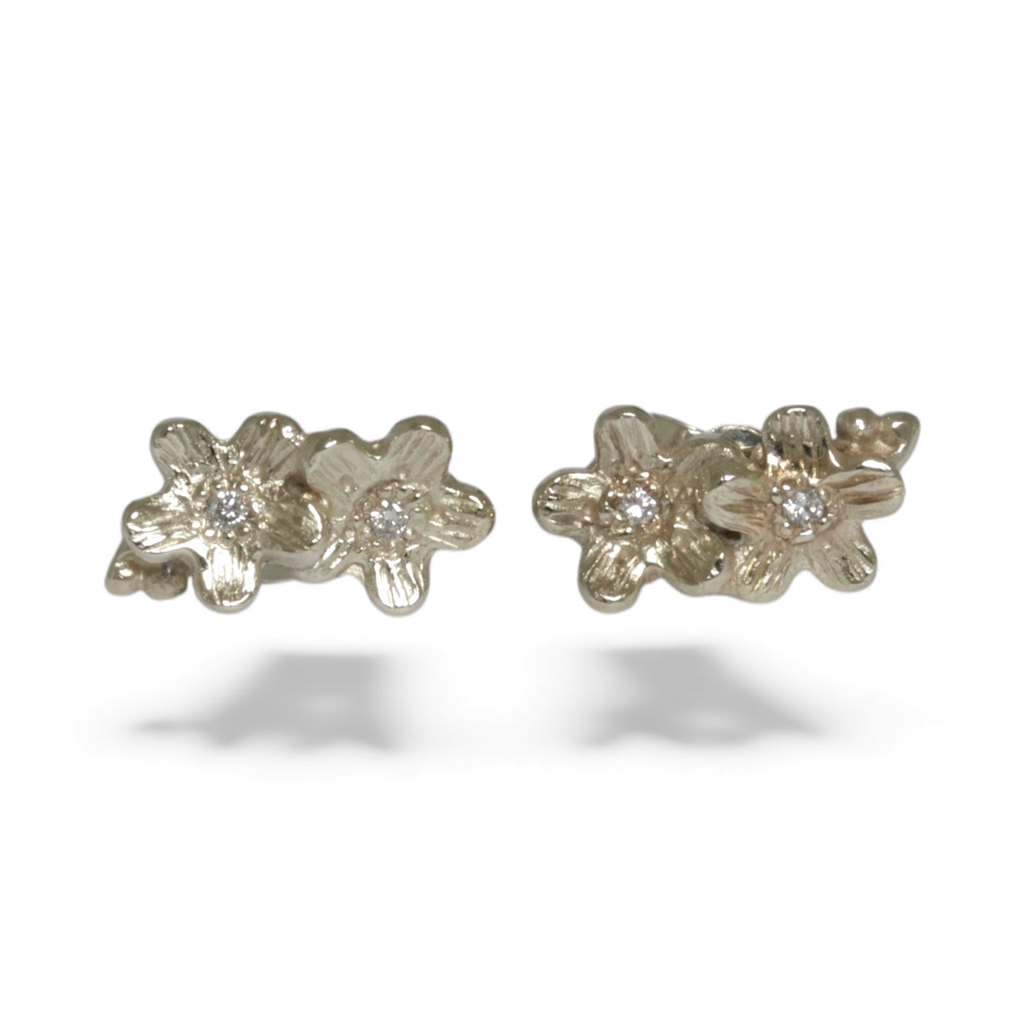 small 9 carat white gold diamond stud flower earrings