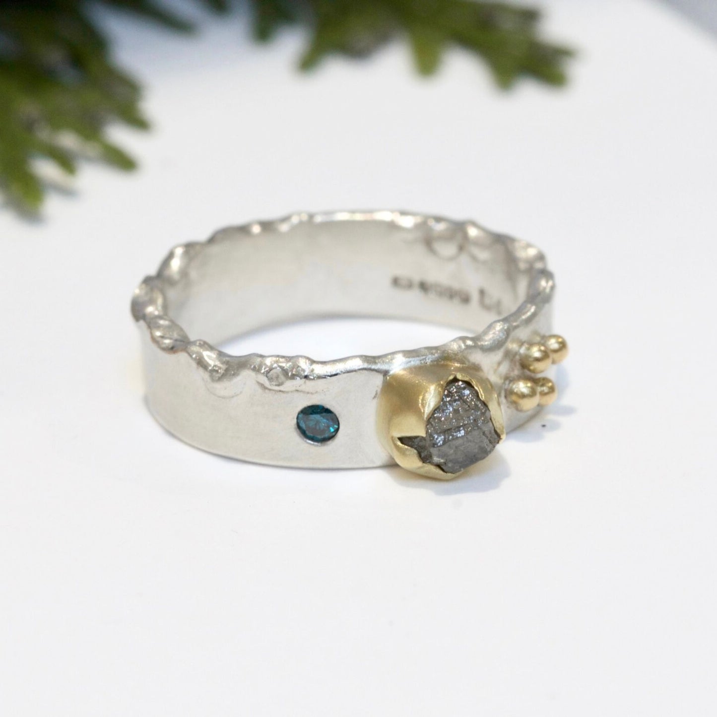 Rough Natural Grey diamond band ring. Sterling silver band set with a natural raw uncut diamond in 18ct yellow gold and a blue brilliant cut diamond. Alternative engagement or wedding ring.