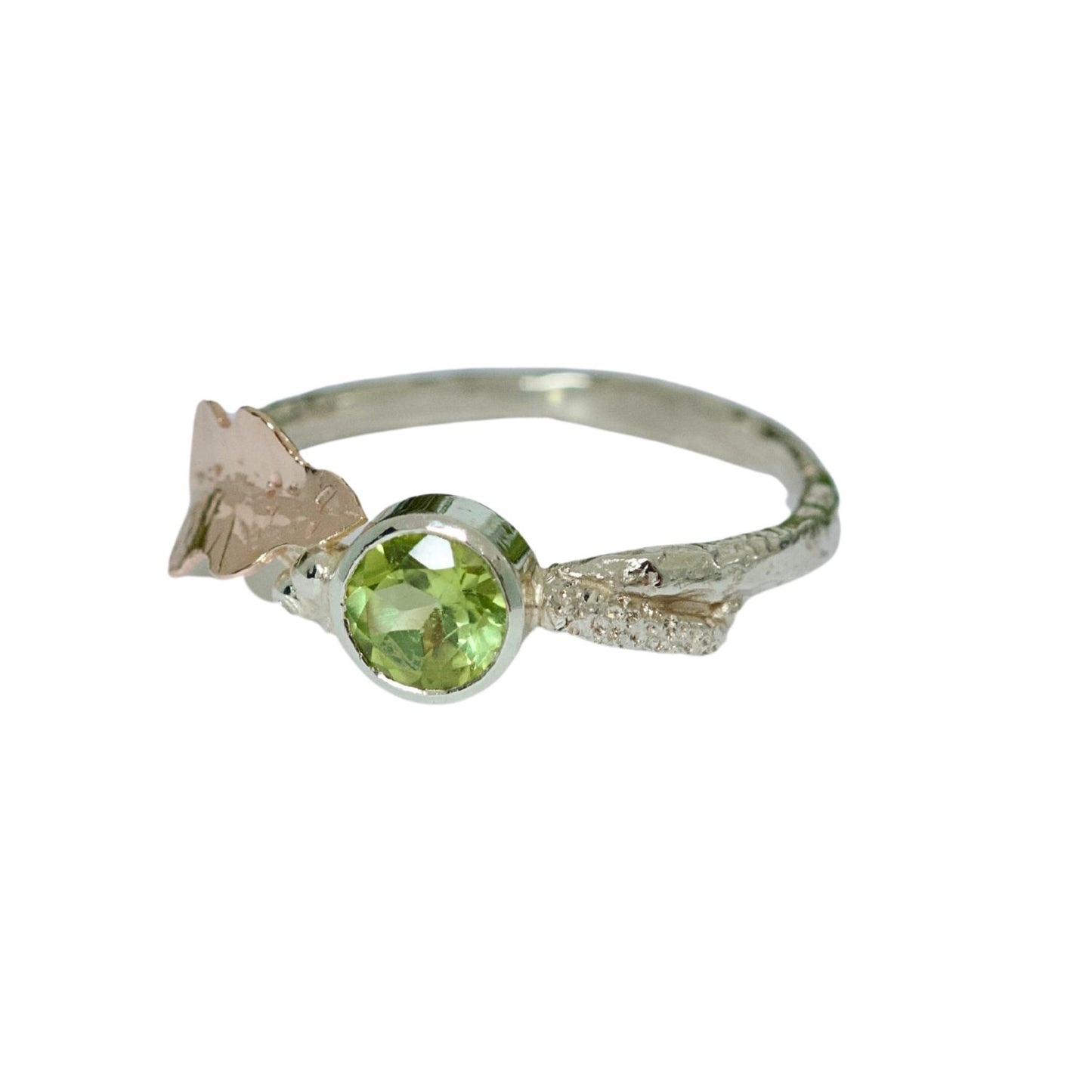 Peridot, August Birthstone, set on a 9ct white gold twig band with a contrasting hand pierced and engraved 9ct rose gold oak leaf. Alternative Nature Inspired Engagement Ring.