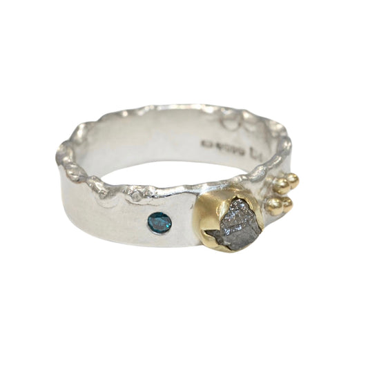 Rough Natural Grey diamond band ring. Sterling silver band set with a natural raw uncut diamond in 18ct yellow gold and a blue brilliant cut diamond. Alternative engagement or wedding ring.