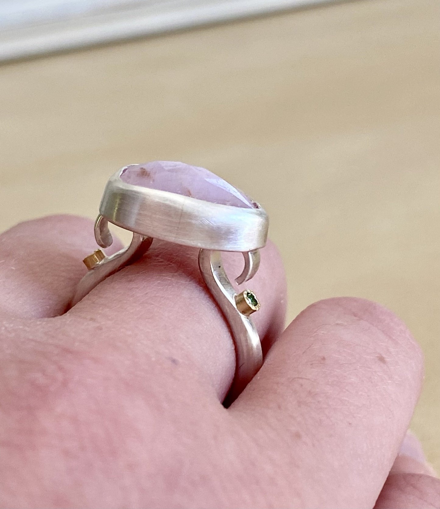 Handmade sculptural baby pink sapphire ring handmade in satin finished silver with green diamonds set in 18ct gold.