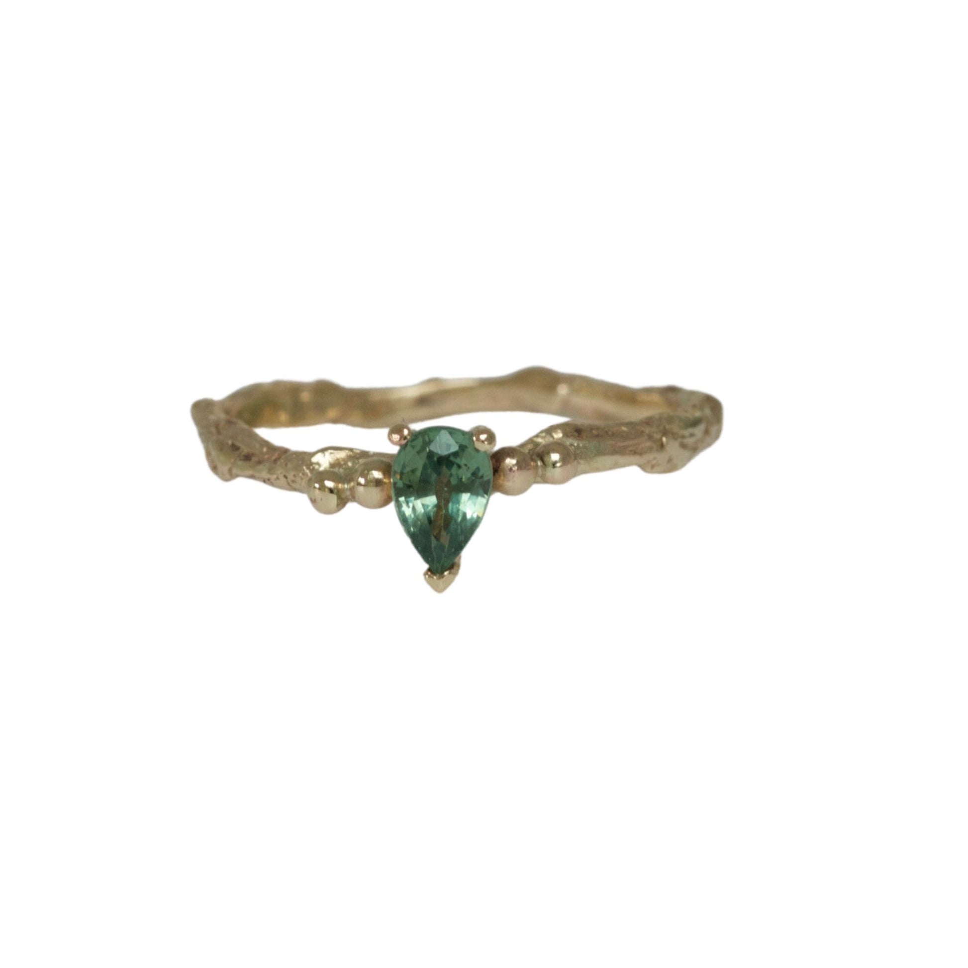 green sapphire and gold nature engagement ring