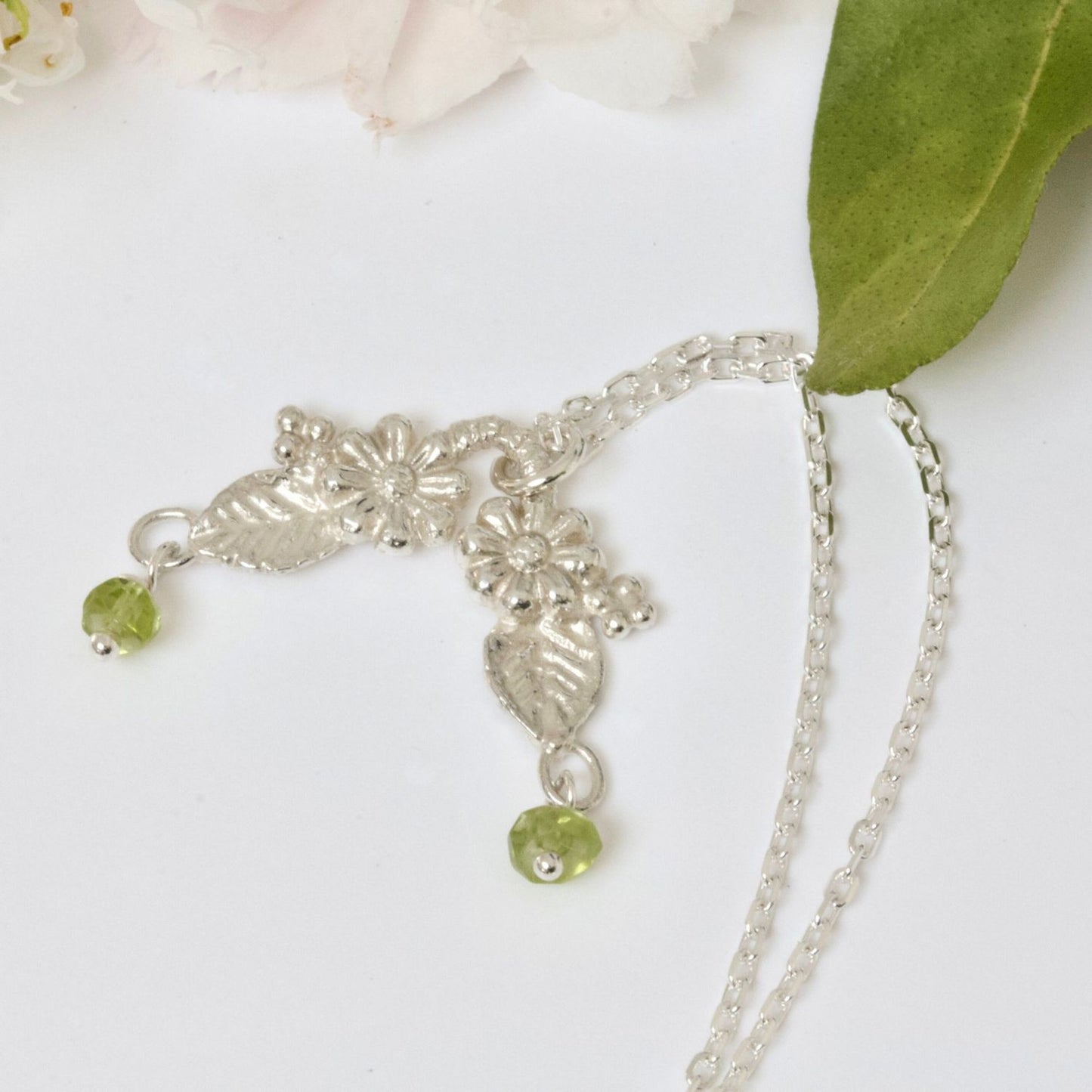 silver woodland blossom necklace with peridot