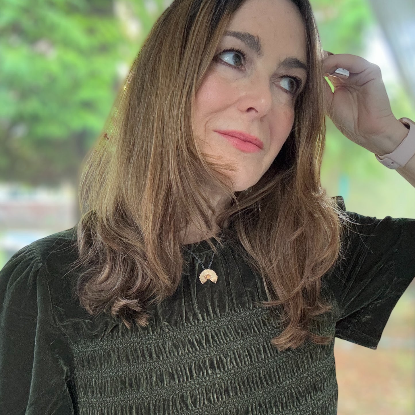 Orange Sapphire and Gold Sunset Pendant on blackened silver chain.