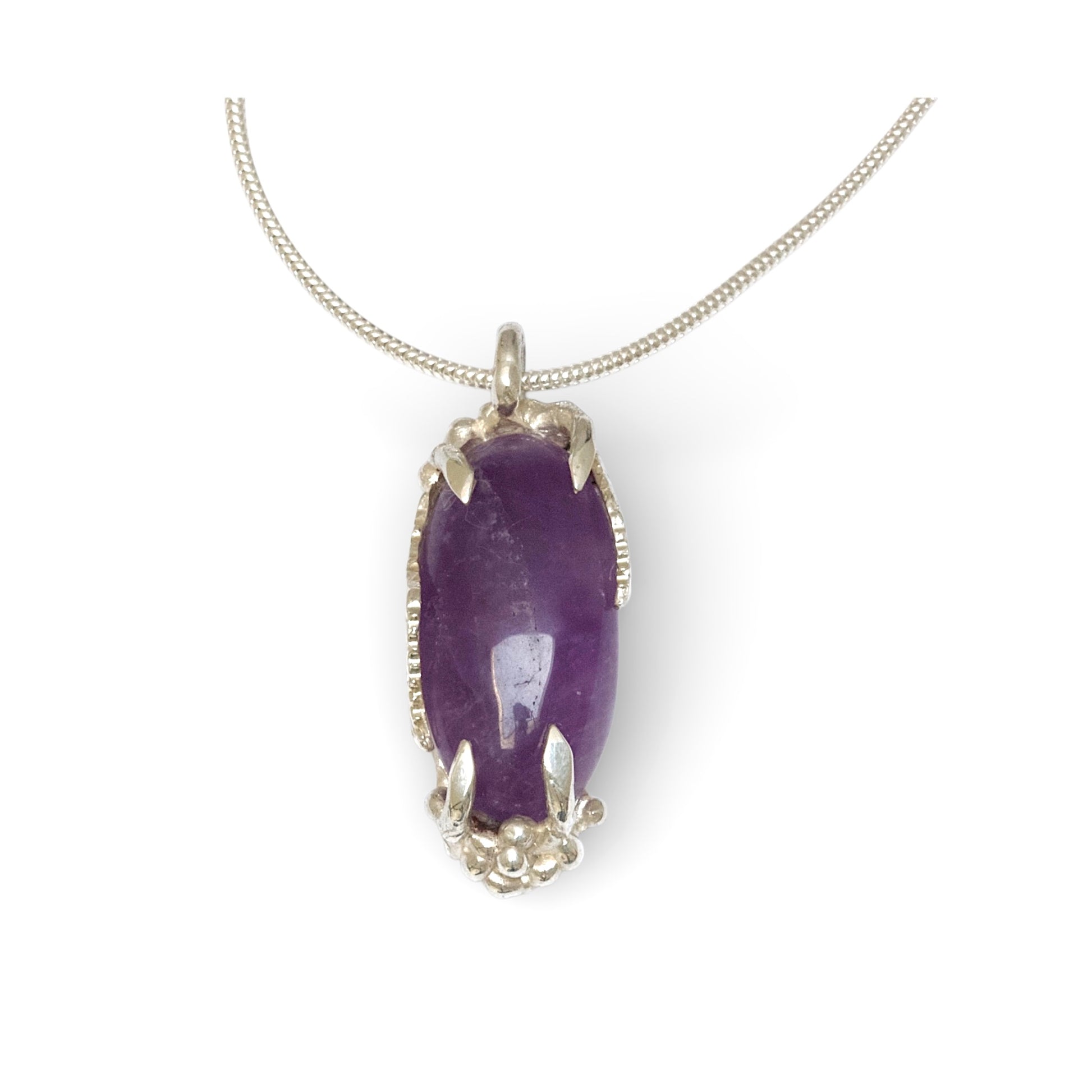 Hand carved sterling silver pendant with long oval cabochon amethyst, nature inspired twig and leaf setting on silver snake chain
