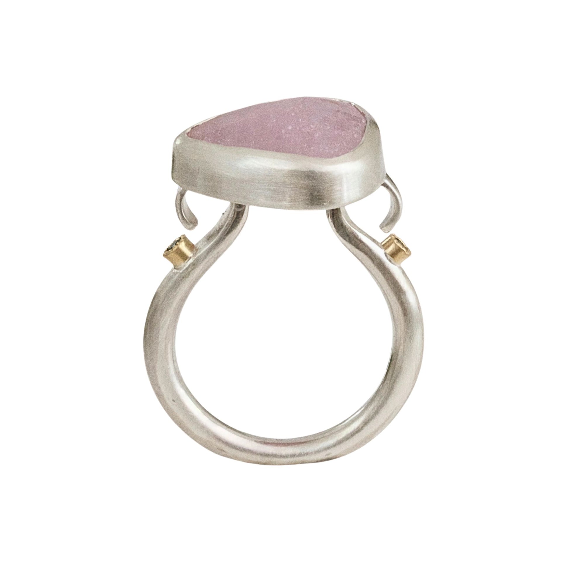 Handmade sculptural baby pink sapphire ring handmade in satin finished silver with green diamonds set in 18ct gold.