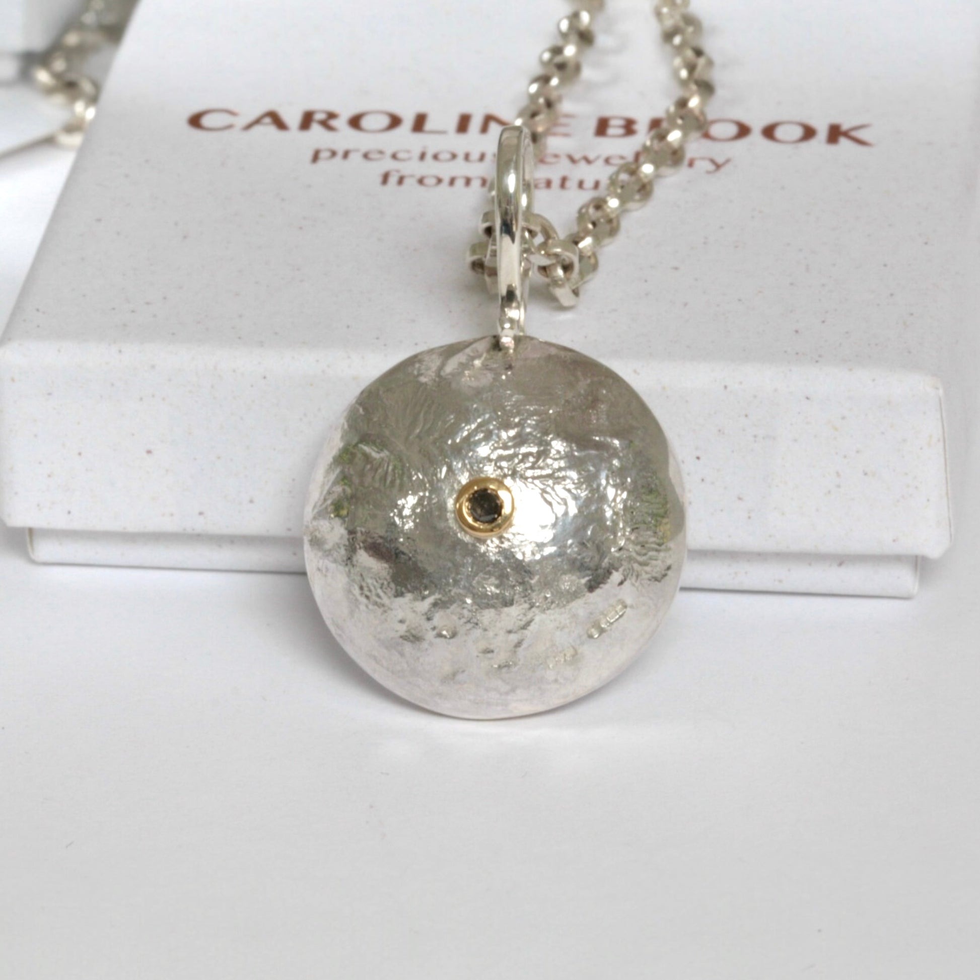 Reticulated silver necklace with salt and pepper diamond set in 18ct gold.
