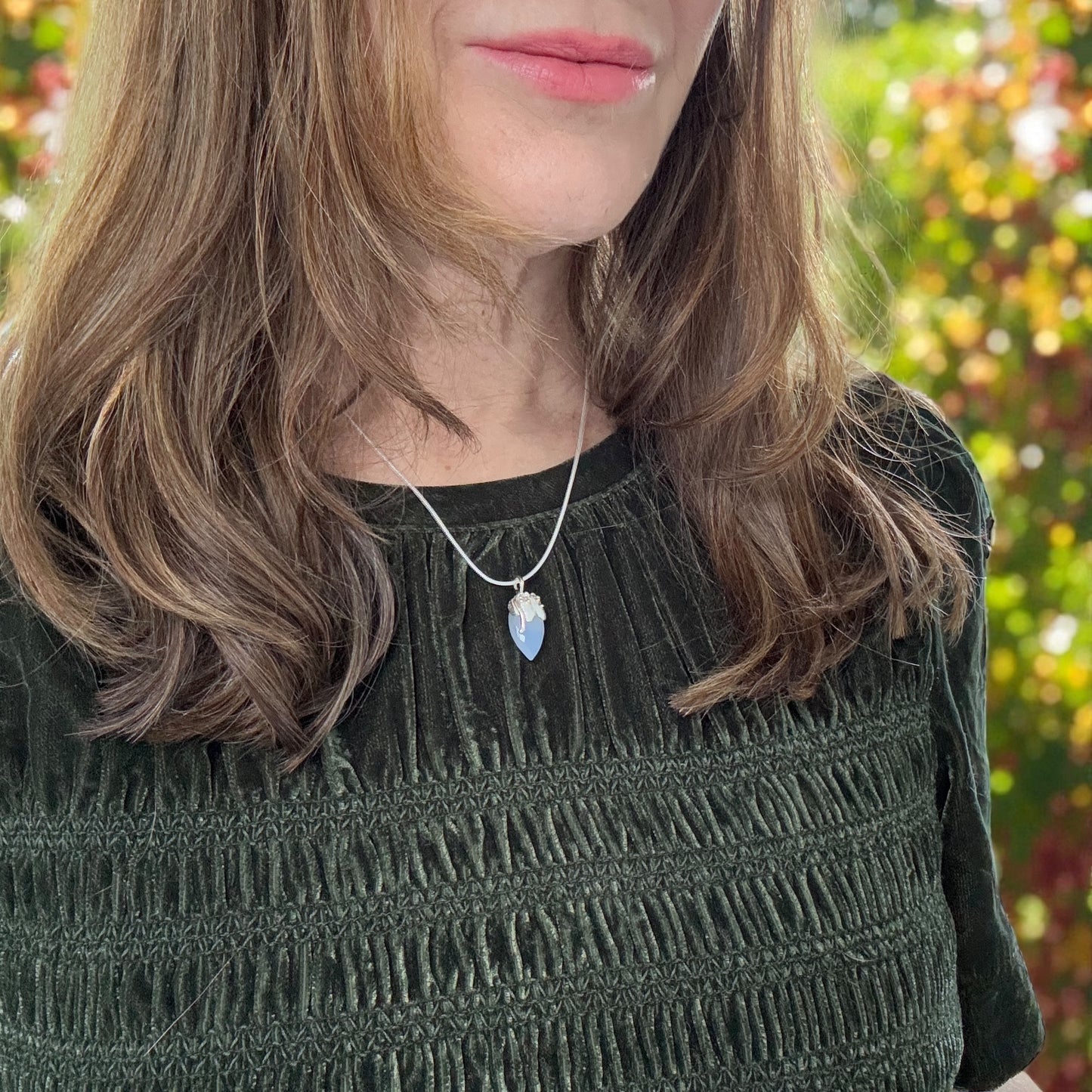 Opalescent blue broilet chalcedony stone set in silver with 18ct gold granulation.