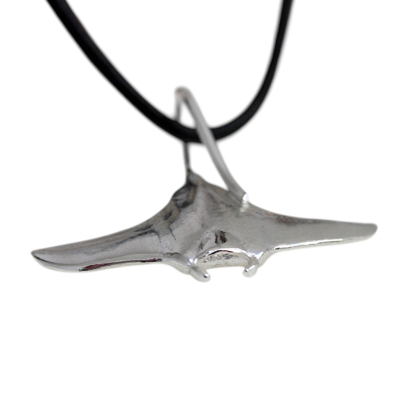 showing the cephalic lobes on a silver manta ray pendant.
