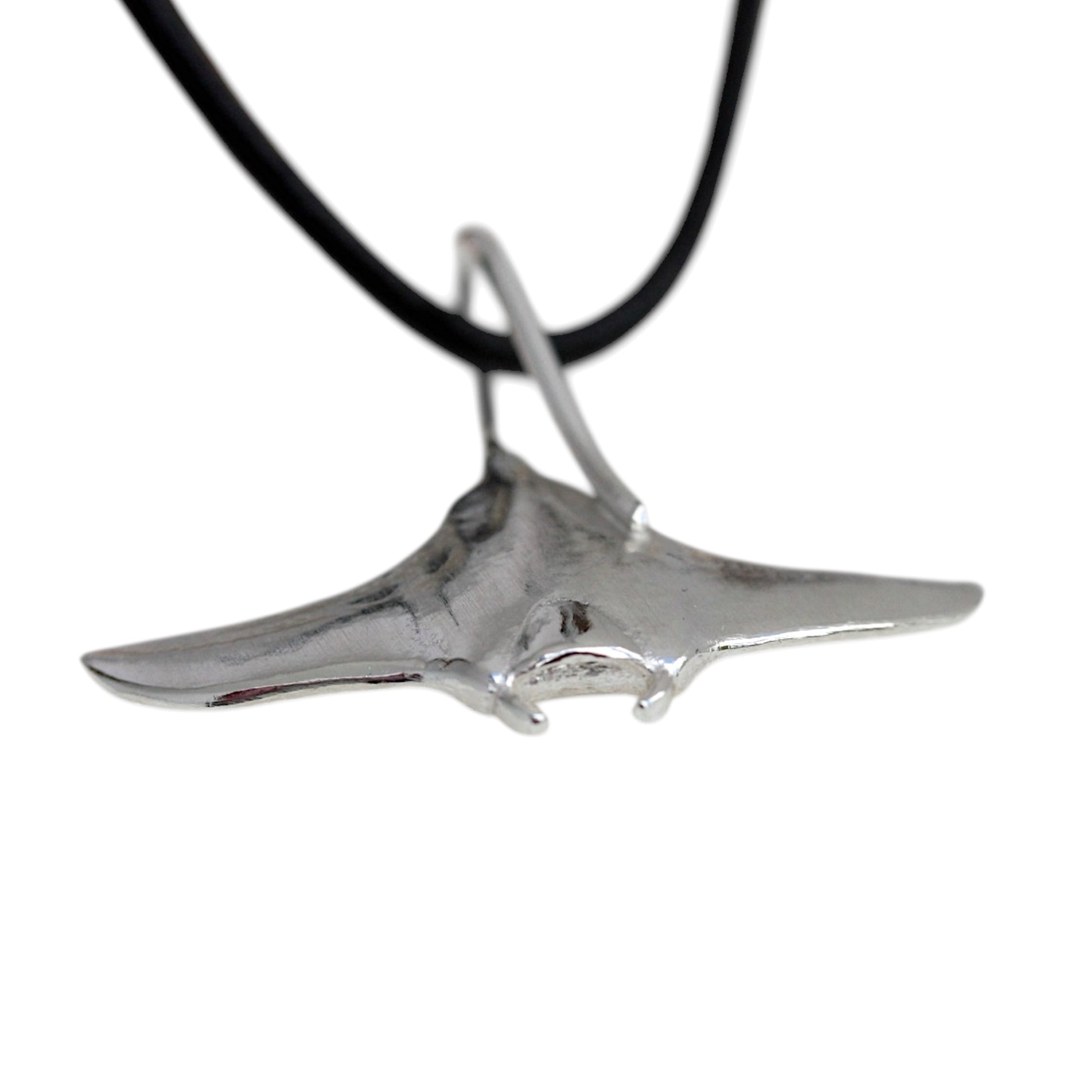 showing the cephalic lobes on a silver manta ray pendant.
