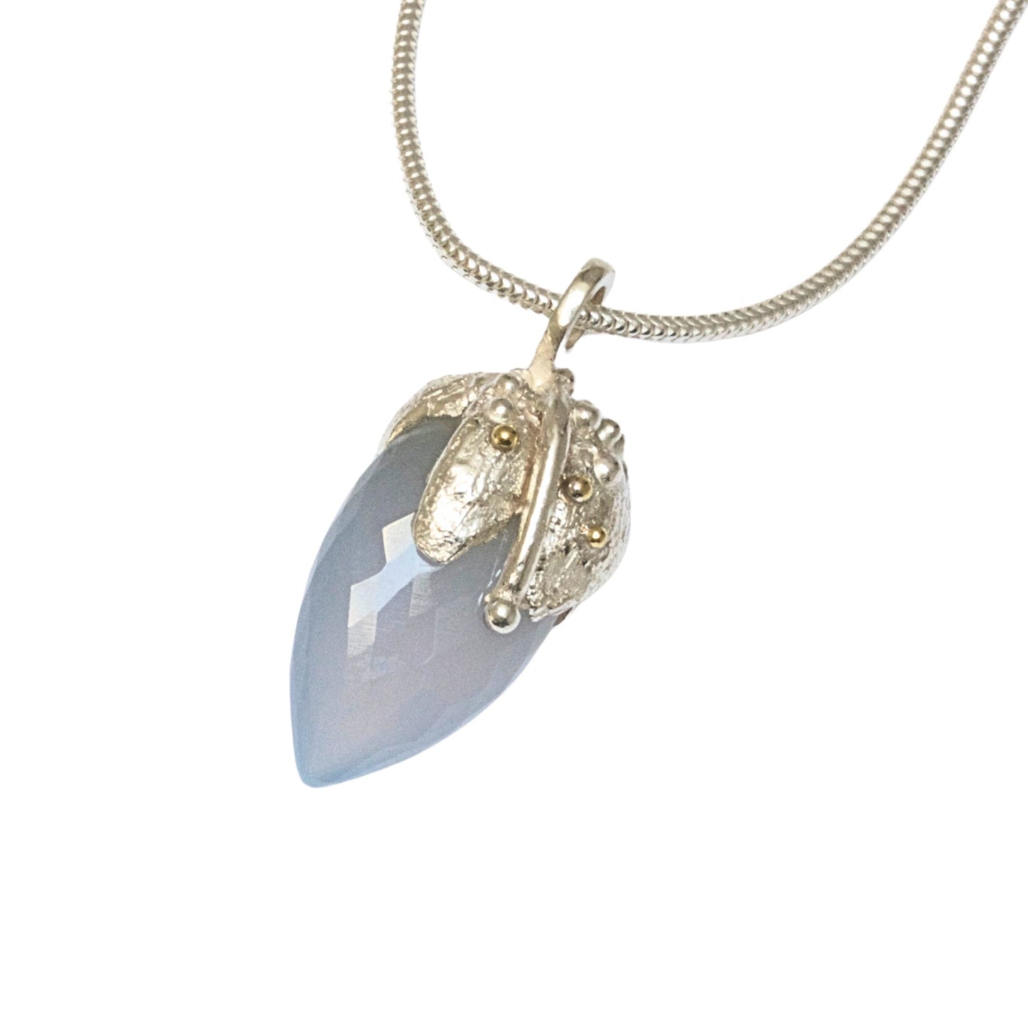 Chalcedony stone set in silver with 18ct gold granulation. Handmade.