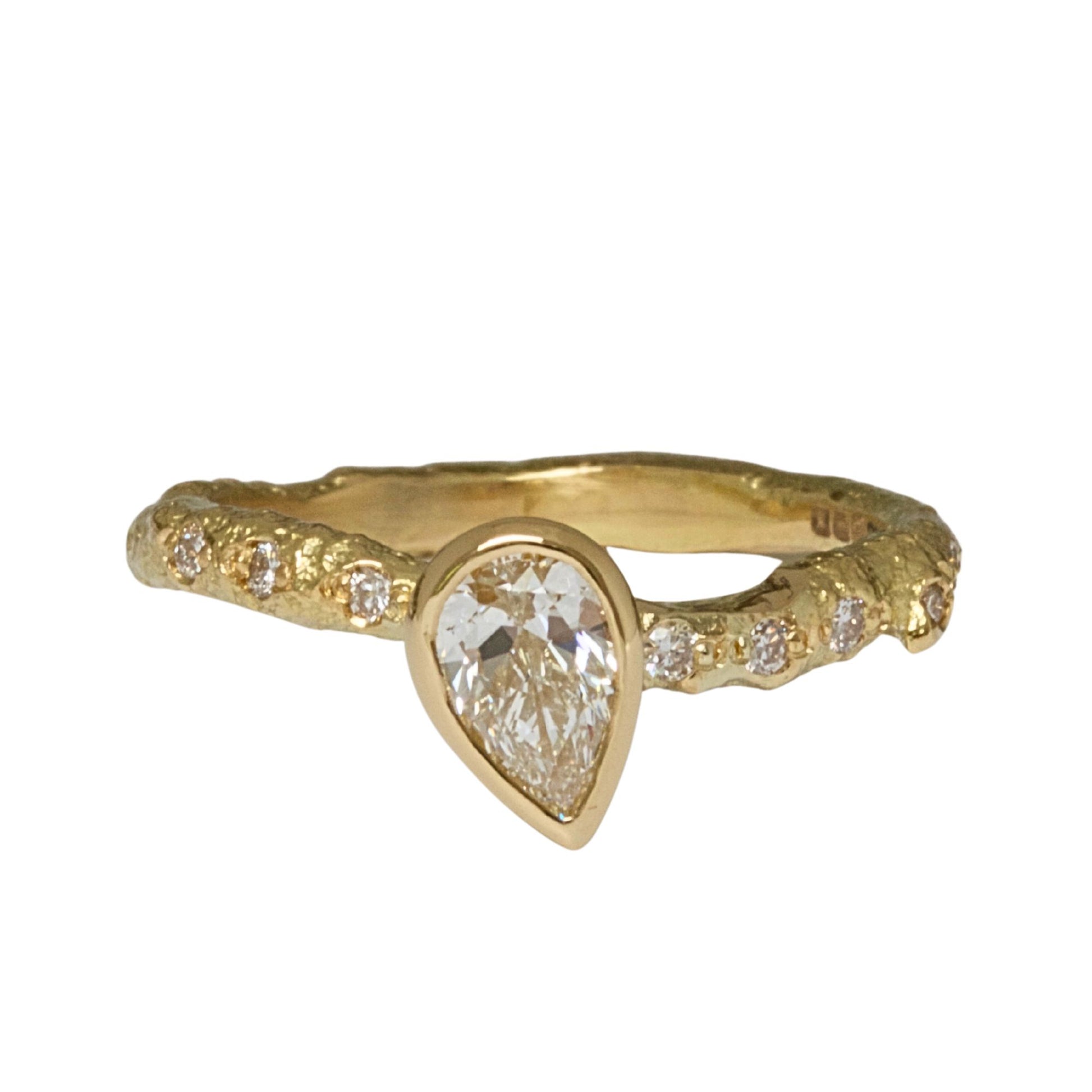 Lab grown pear shaped diamond organic engagement ring.
