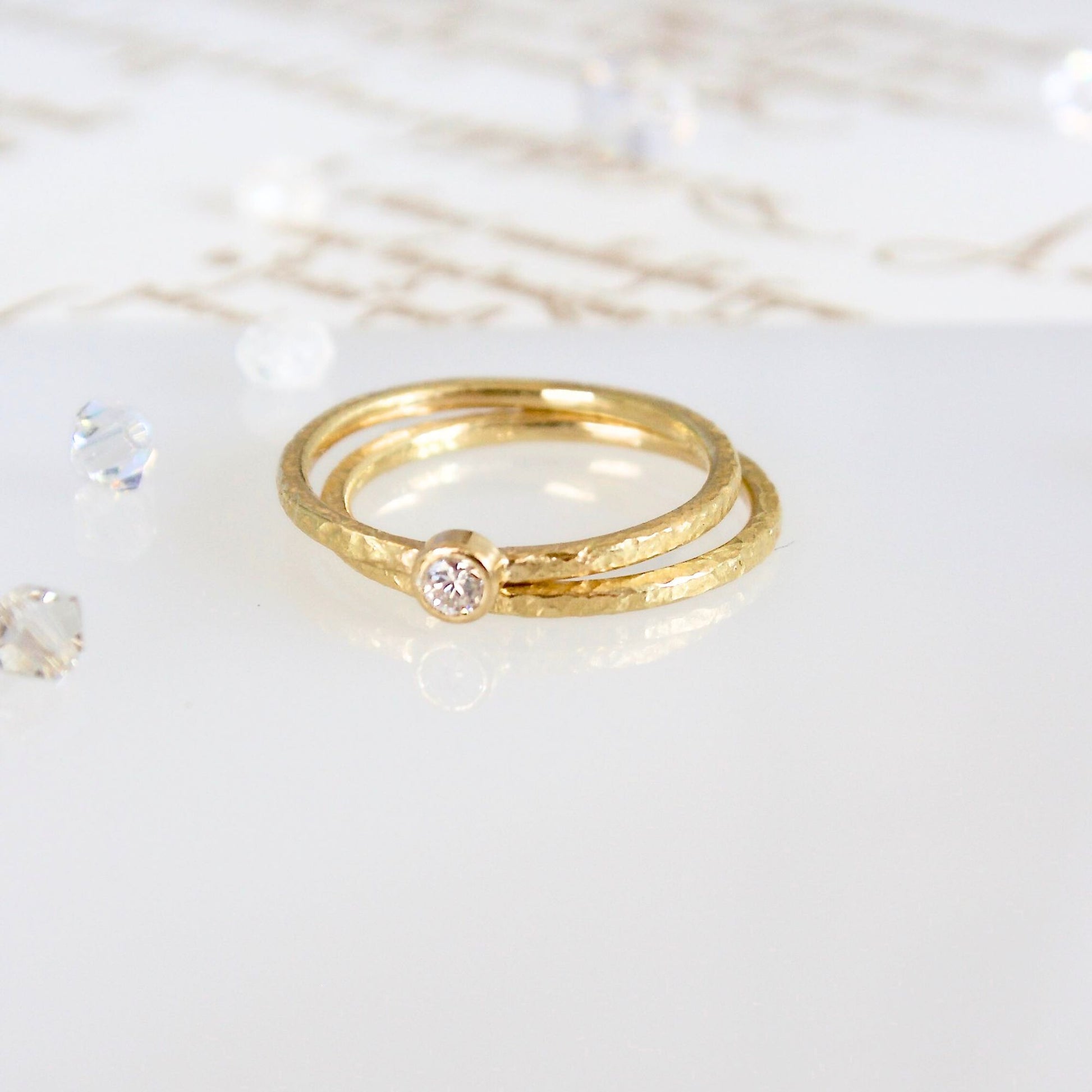 Textured 18ct gold slim, skinny ring with a bezel set 0.10ct natural diamond.