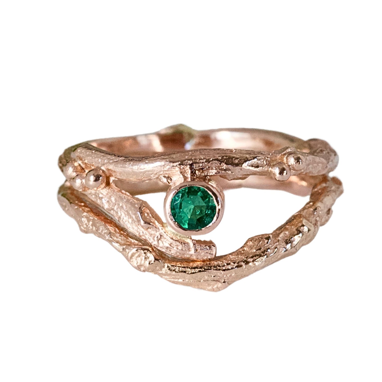 Rose Gold nature inspired twig engagement and wedding ring set. Cast from a real twig in 9ct red gold and set with a natural Emerald.