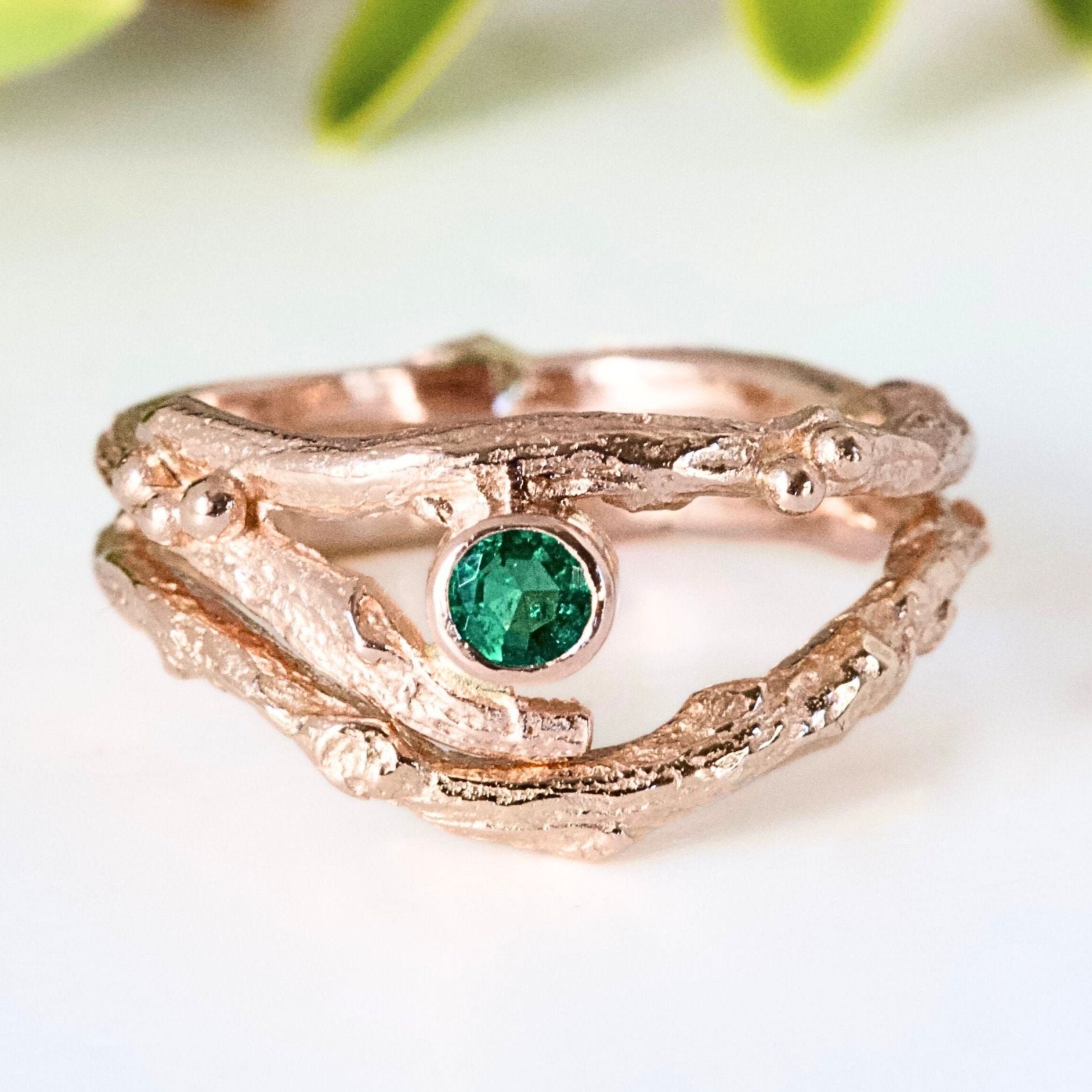 Rose Gold nature inspired twig engagement and wedding ring set. Cast from a real twig in 9ct red gold and set with a natural Emerald.