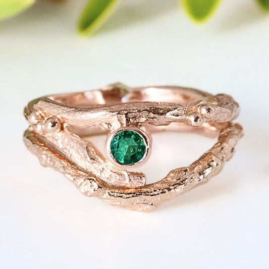 Rose Gold nature inspired twig engagement and wedding ring set. Cast from a real twig in 9ct red gold and set with a natural Emerald.