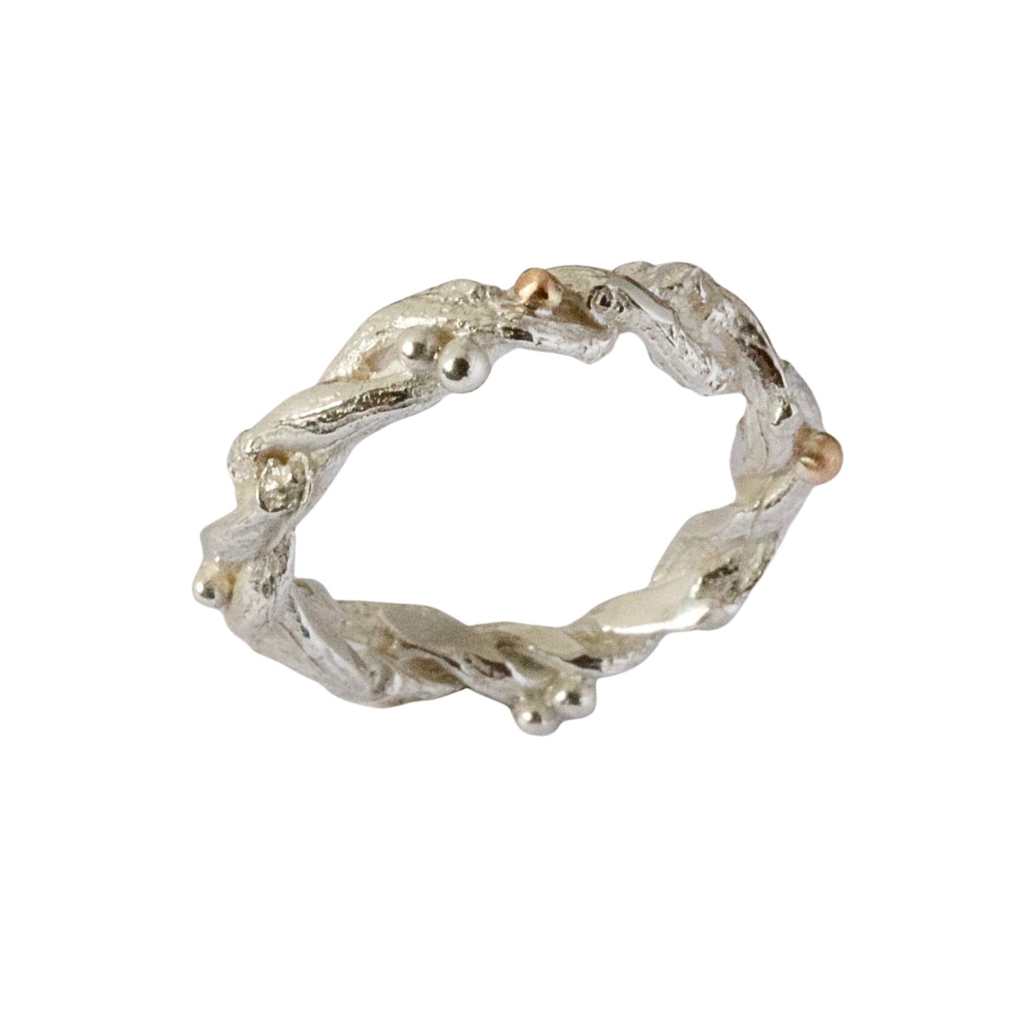 Entwined sterling silver twig ring with silver and 9ct gold berries, handcrafted woodland-inspired design.
