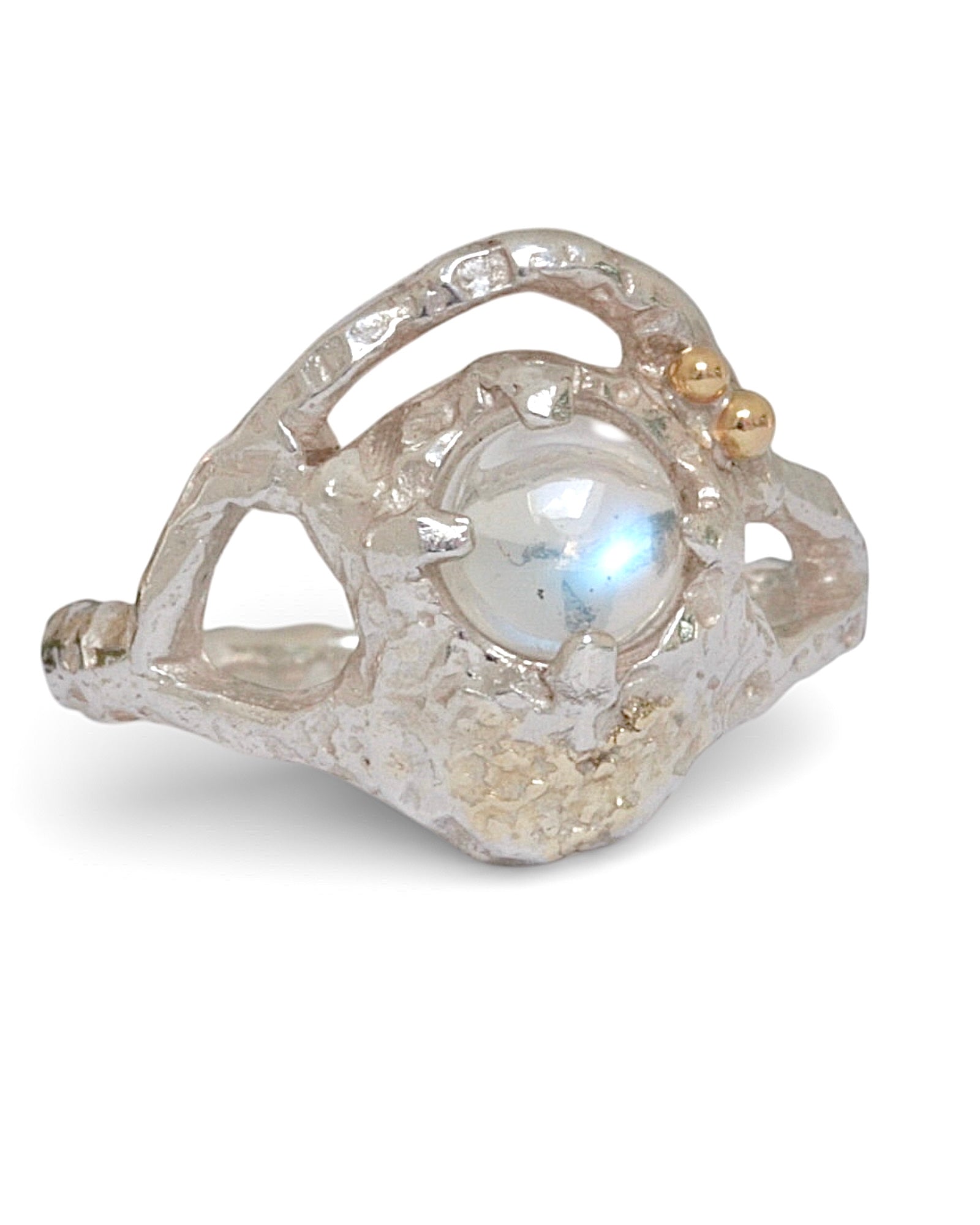 Unique silver Lunar Ring with a central cabochon blue moonstone, gold accent spheres, and gold highlights fused into the silver band, handcrafted with organic texture.