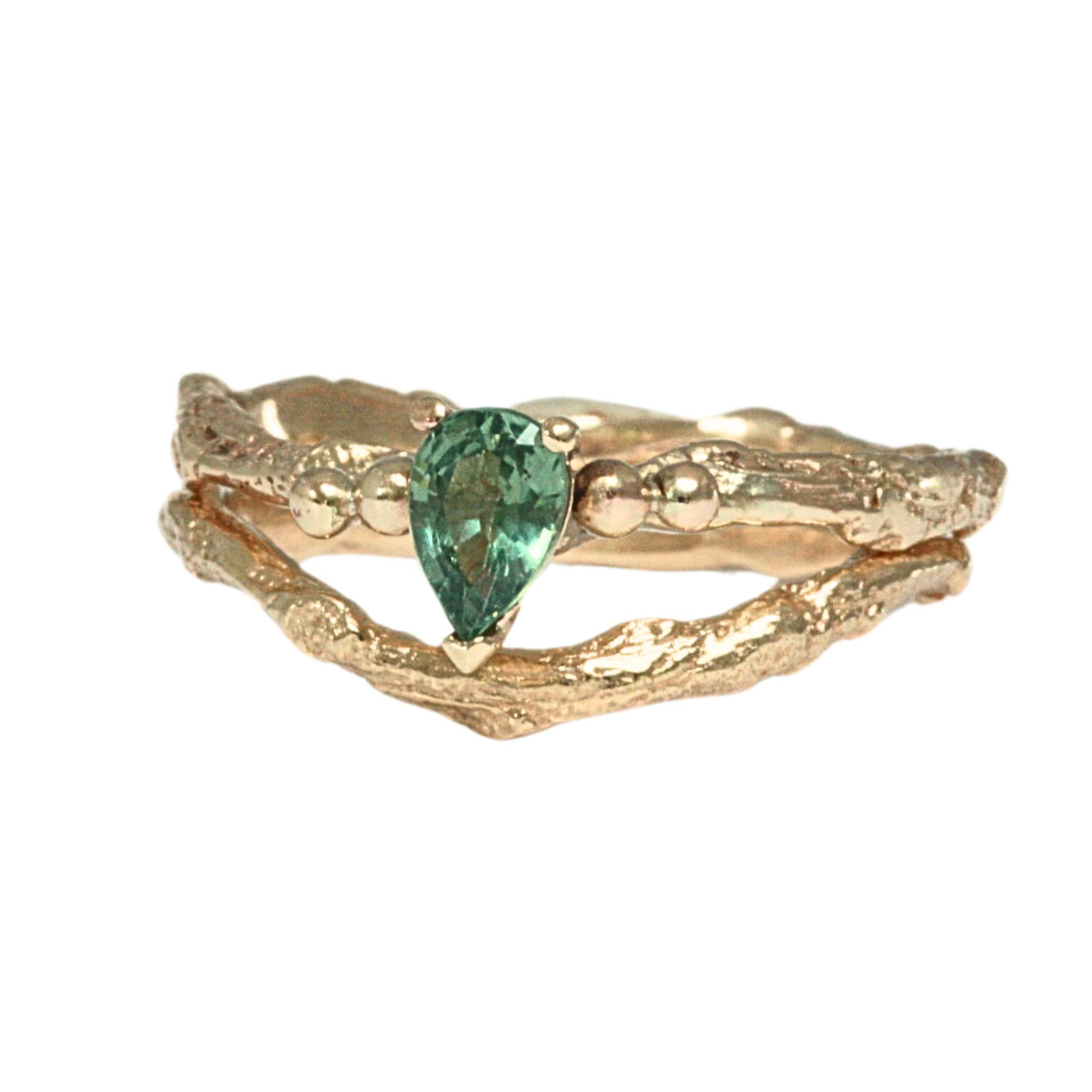 Pear shape green sapphire nature inspired twig engagement ring. Cast from a real twig in 9ct yellow gold and set with a teardrop green sapphire in a claw setting. Also can be ordered in white gold.