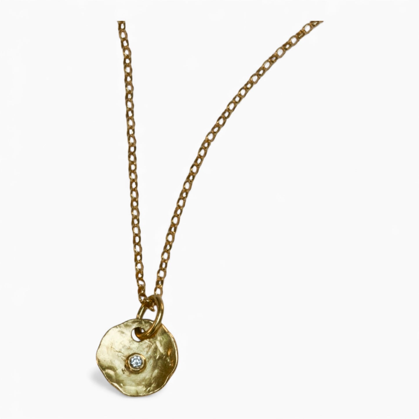 Hammered 18 carat gold Diamond Pendant on a solid gold chain.