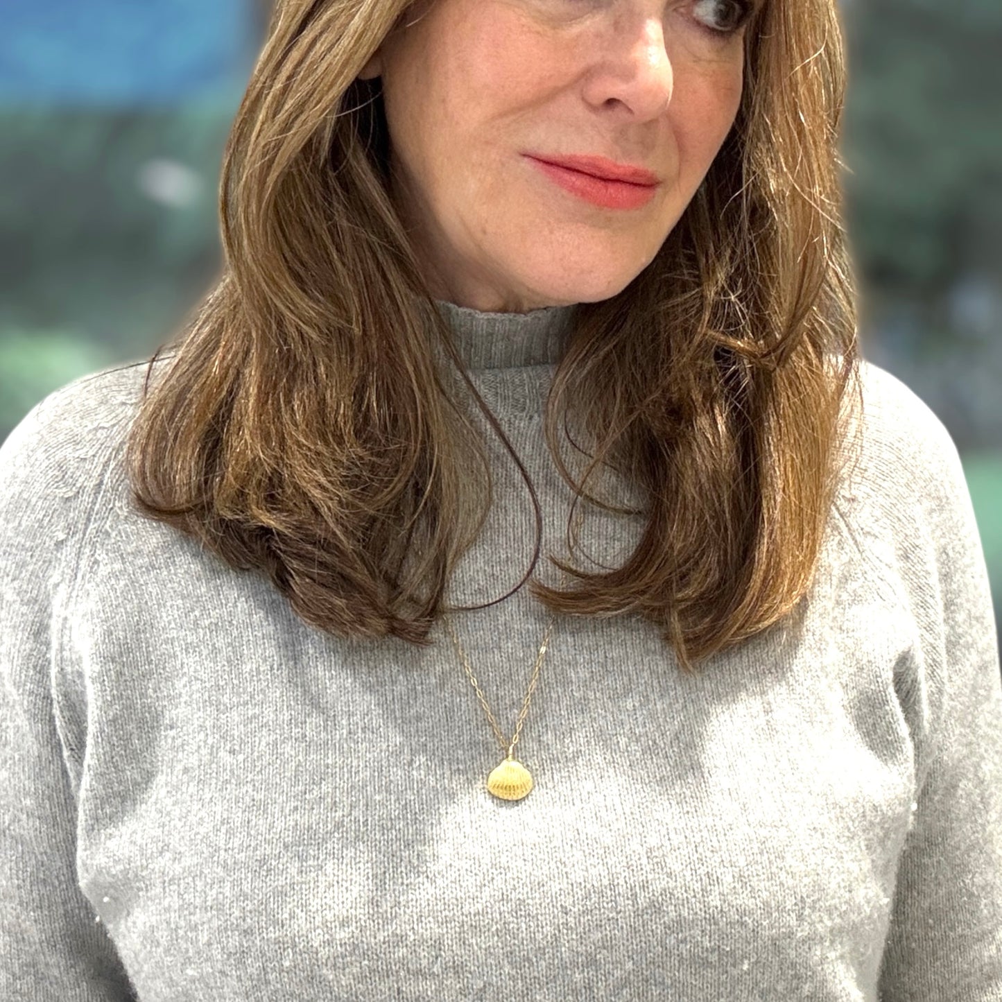 Gold vermeil shell pendant on a long chain