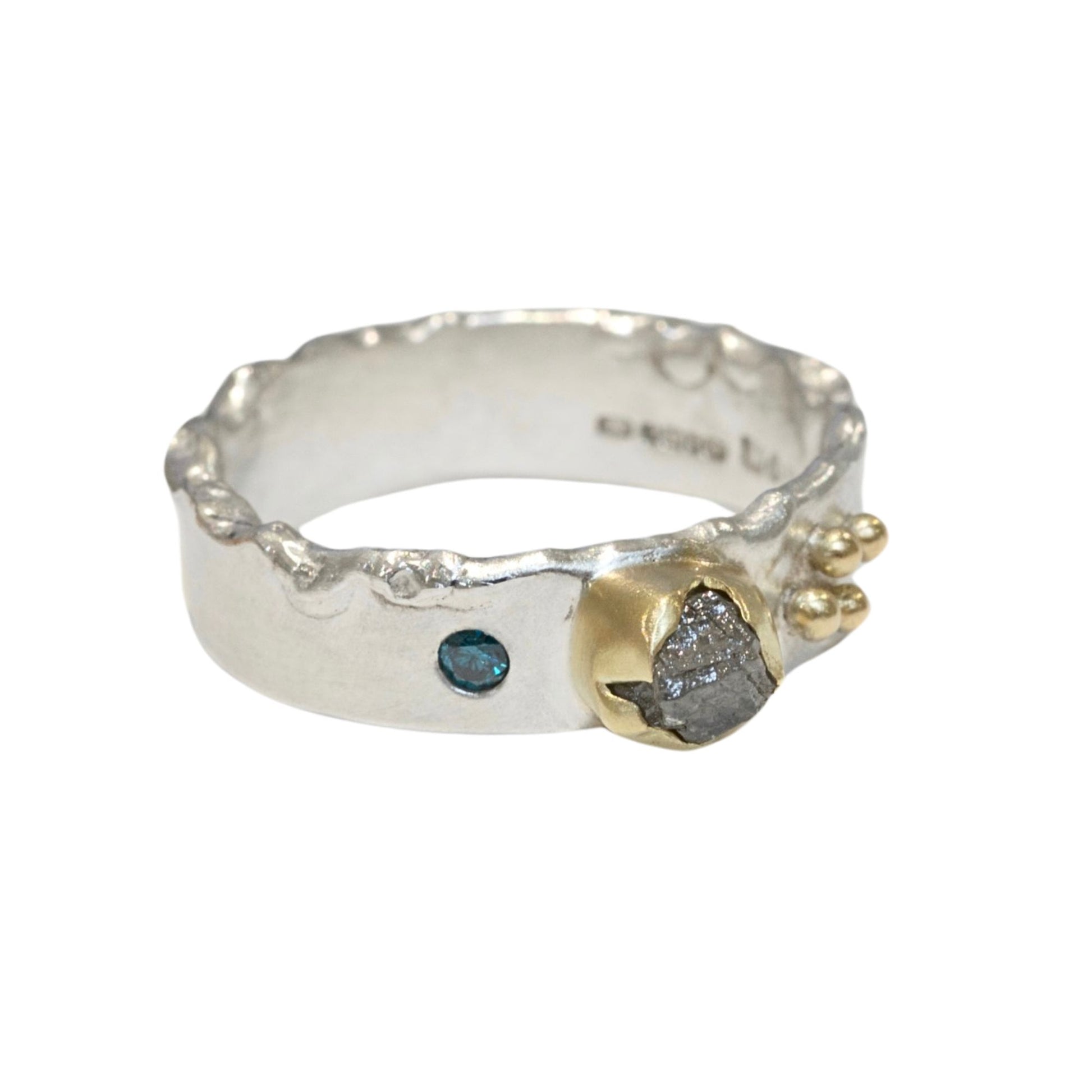 Rough Natural Grey diamond band ring. Sterling silver band set with a natural raw uncut diamond in 18ct yellow gold and a blue brilliant cut diamond. Alternative engagement or wedding ring.
