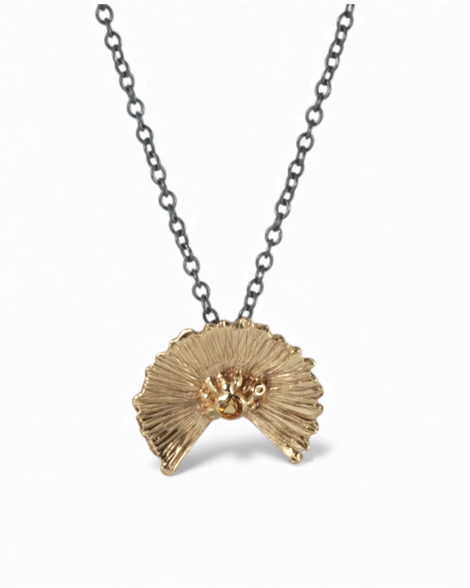 Orange Sapphire Sunset Pendant on blackened silver chain.