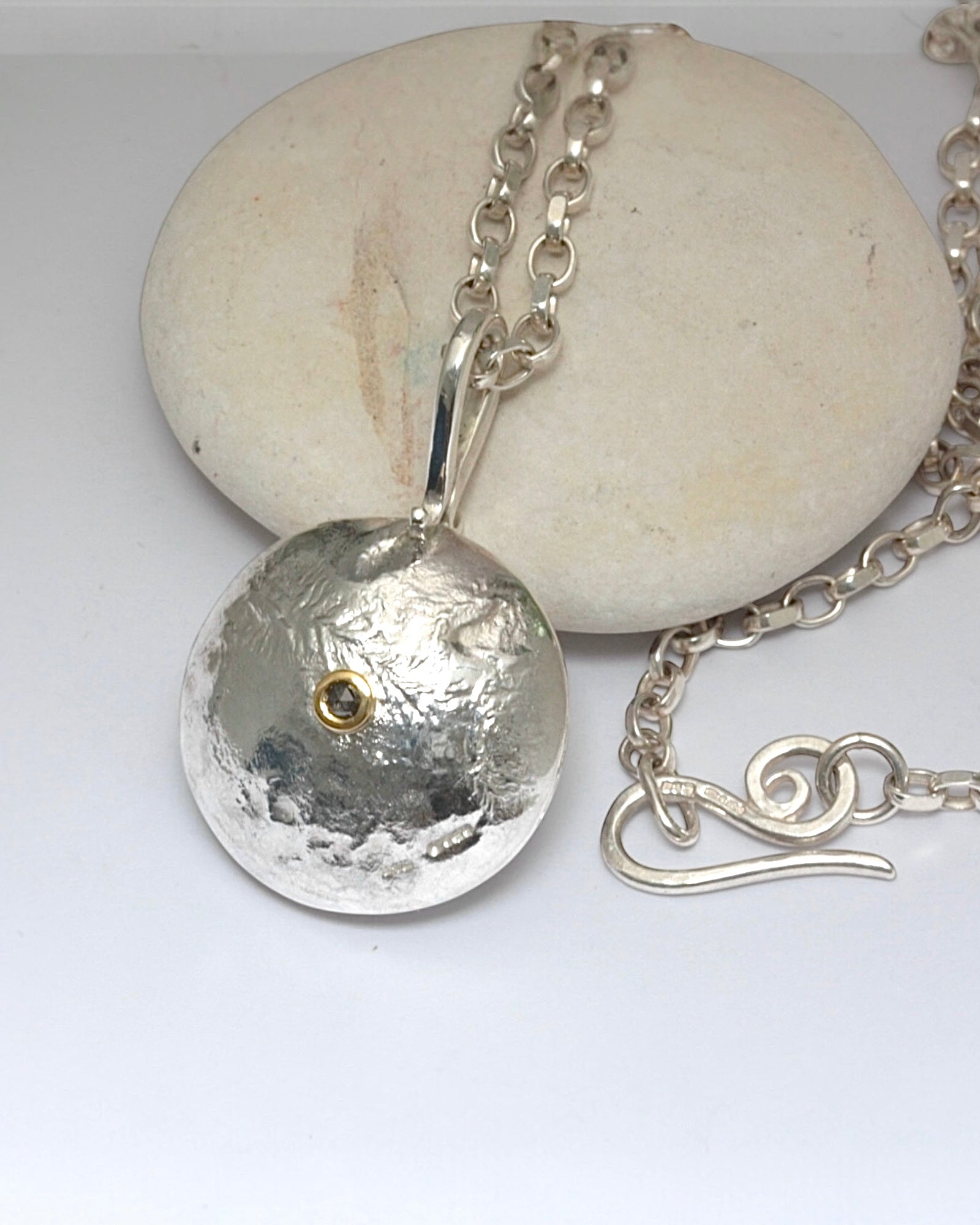 Reticulated silver necklace with salt and pepper diamond set in 18ct gold.