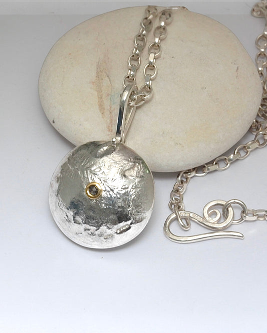 Reticulated silver necklace with salt and pepper diamond set in 18ct gold.