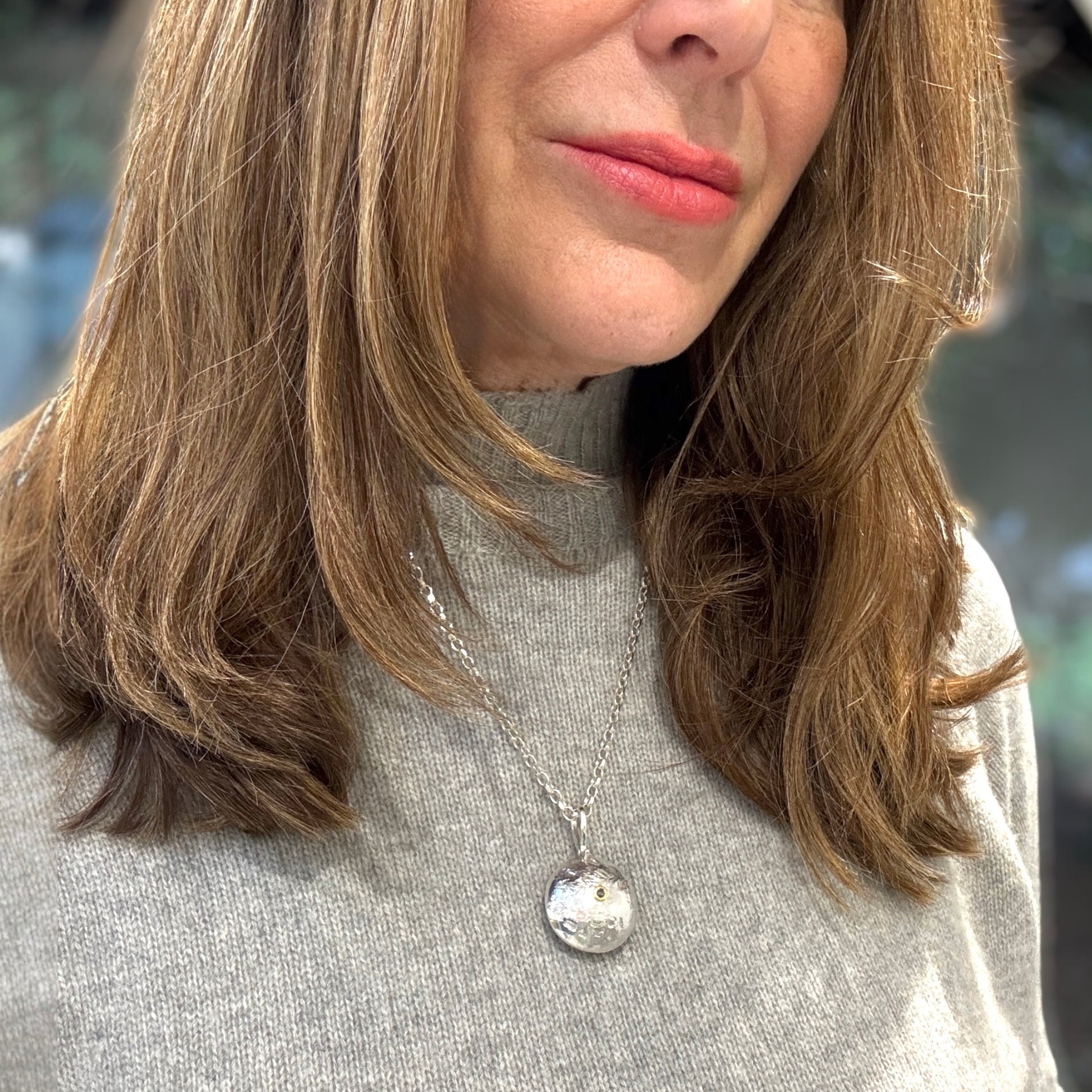 Reticulated silver necklace with salt and pepper diamond set in 18ct gold on heavy silver chain.