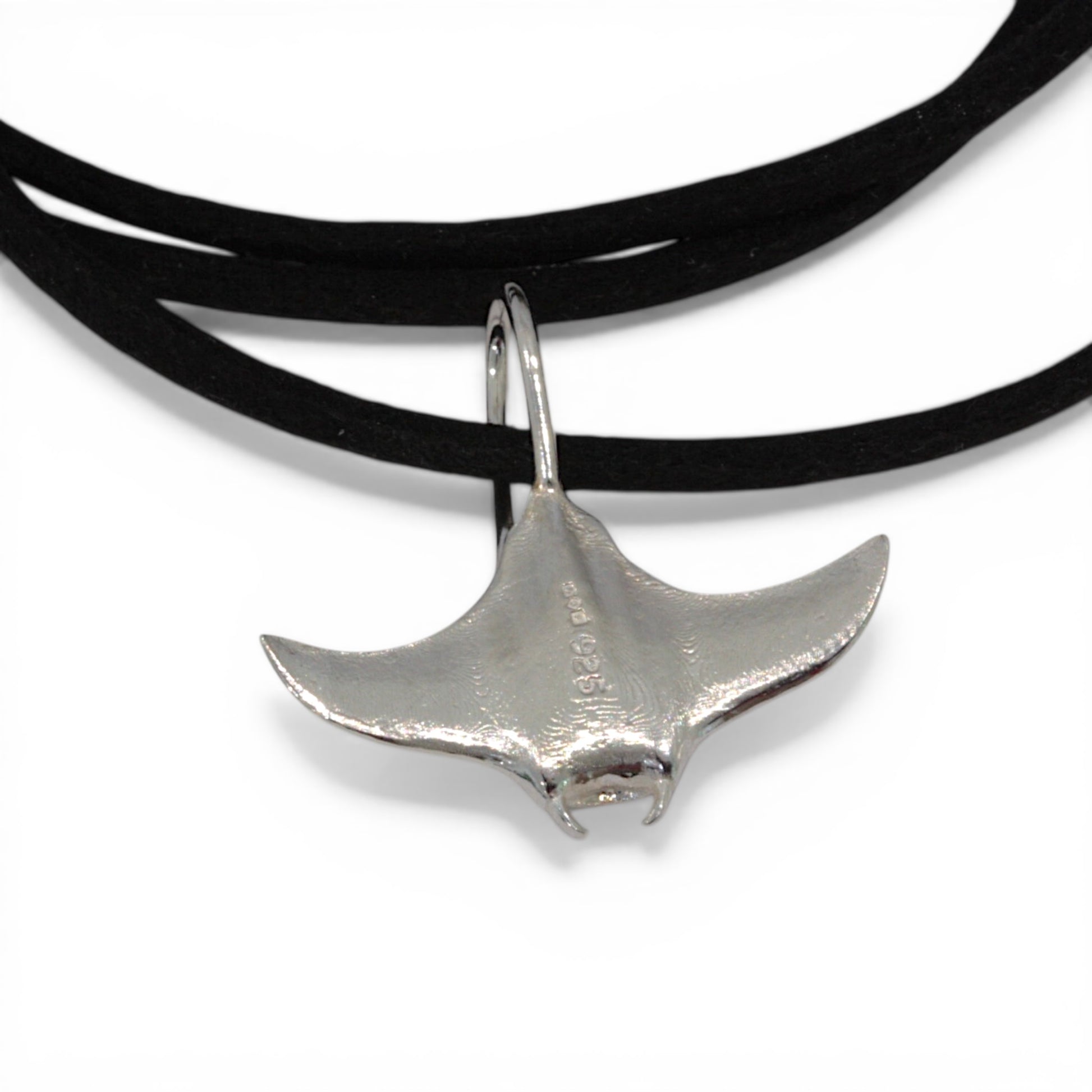 Solid sterling silver manta ray pendant on a faux suede thong necklace.