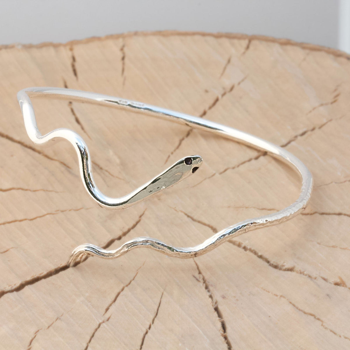 Open cuff style bangle in a snake design