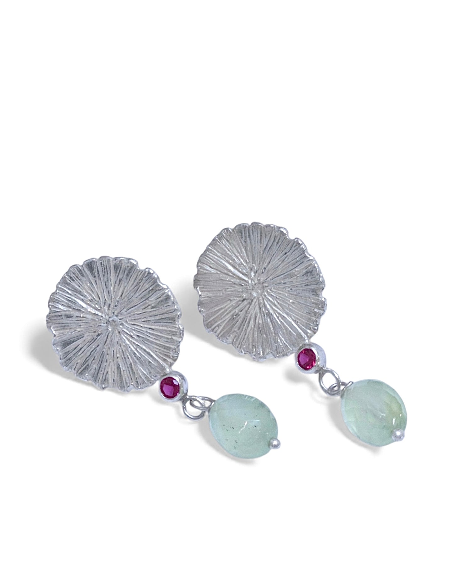 Silver earrings with pink rubies and prehnite beads on a white background