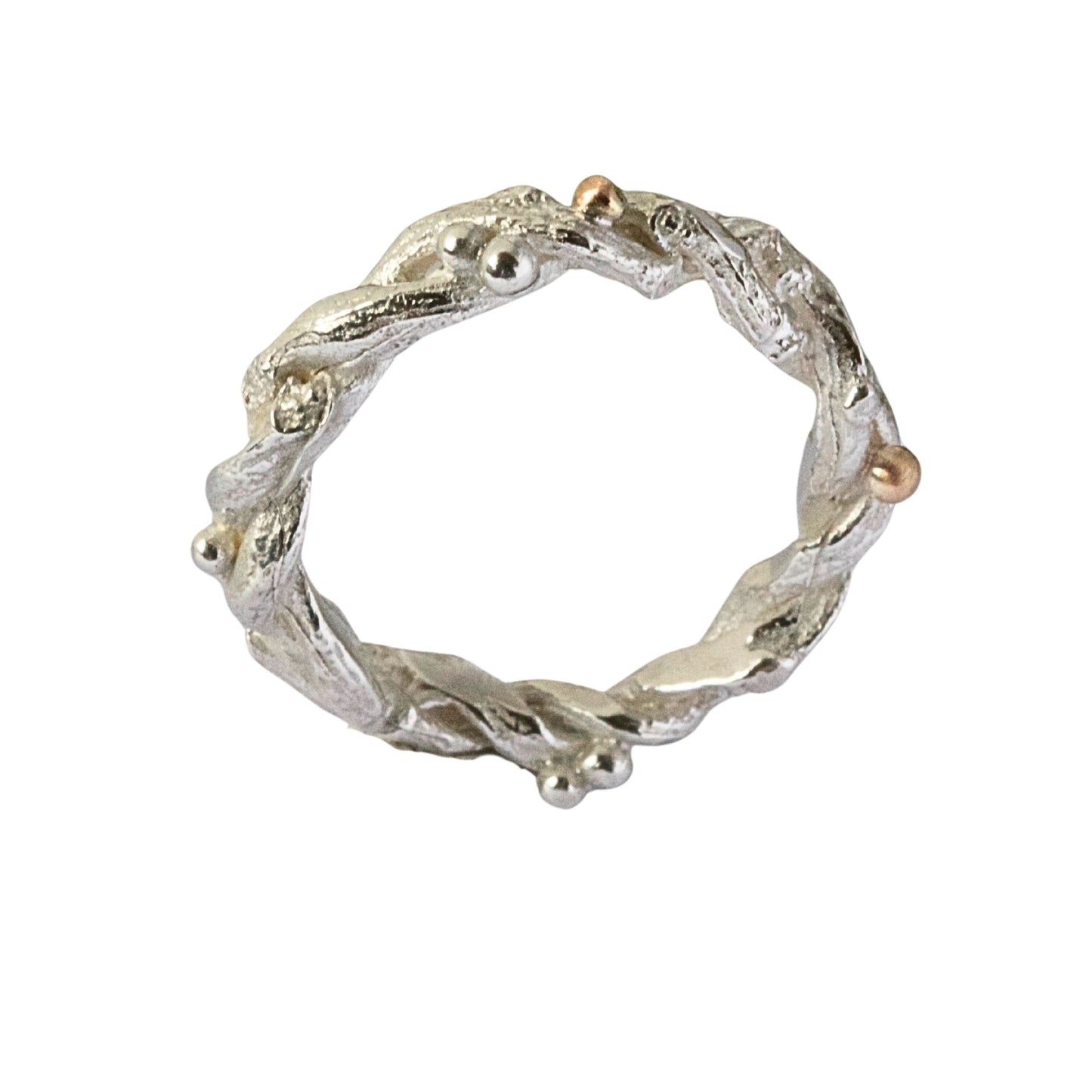Entwined sterling silver twig ring with silver and 9ct gold berries, handcrafted woodland-inspired design.
