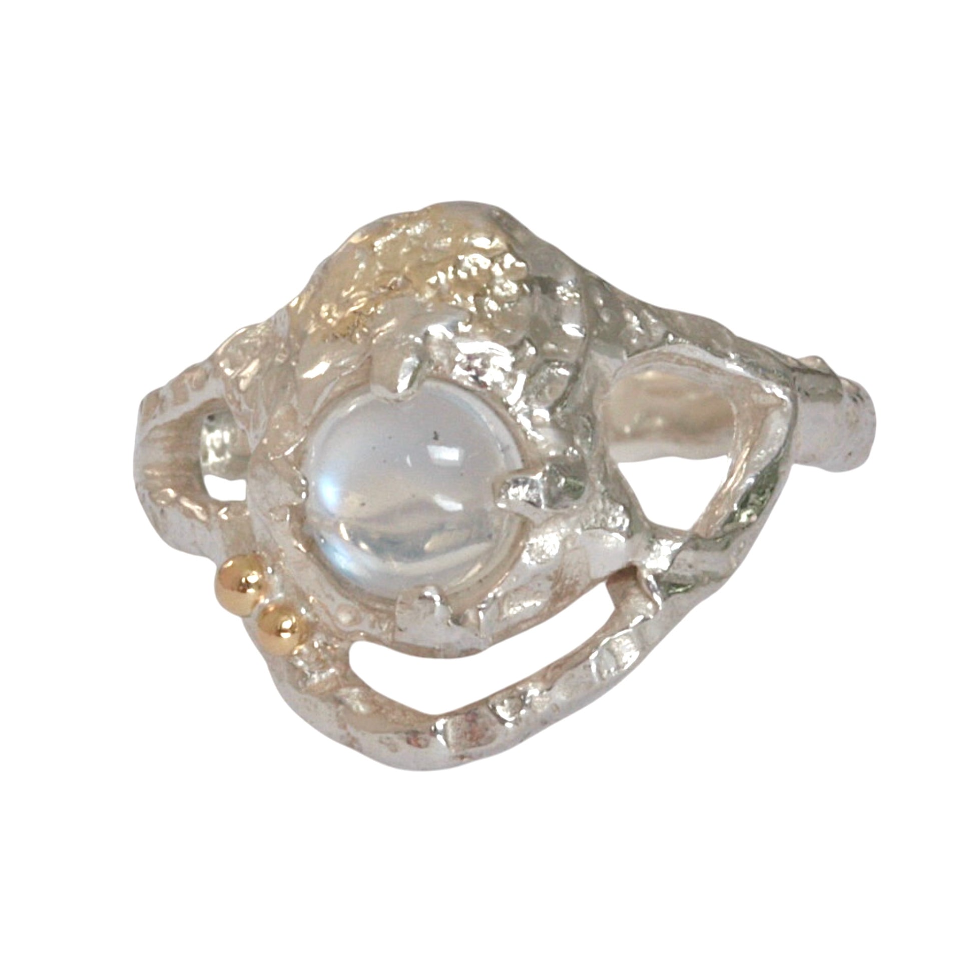 Sterling silver Lunar Ring with a 5mm cabochon blue moonstone, featuring two 18ct gold accent balls and delicate fused gold details. Hand-carved organic shape with textured finish.