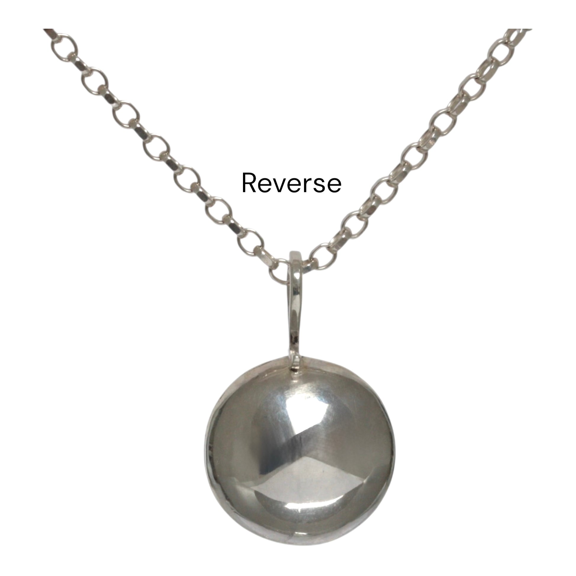 Reticulated silver necklace with salt and pepper diamond set in 18 carat gold.