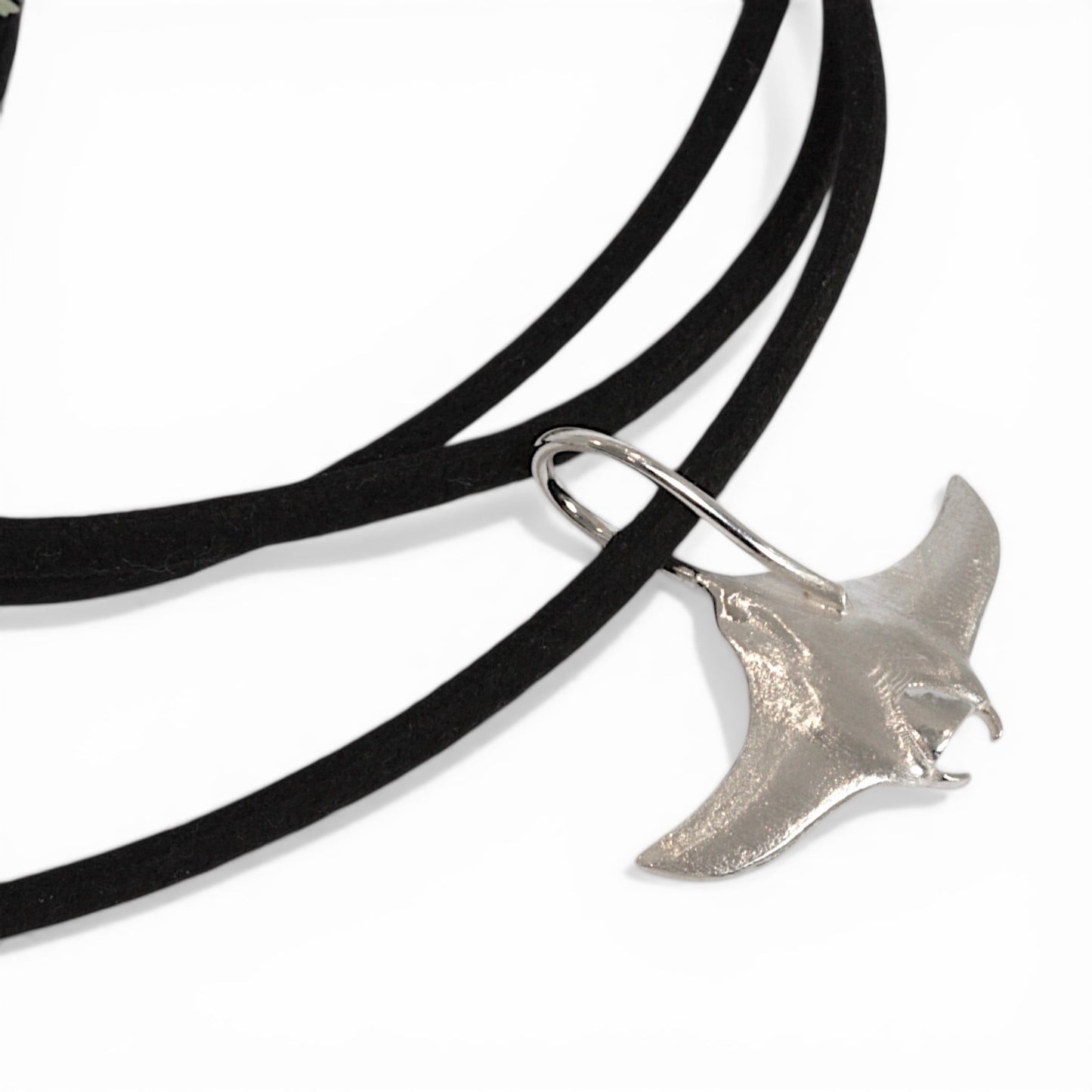 Solid sterling silver manta ray pendant on a faux suede thong necklace.