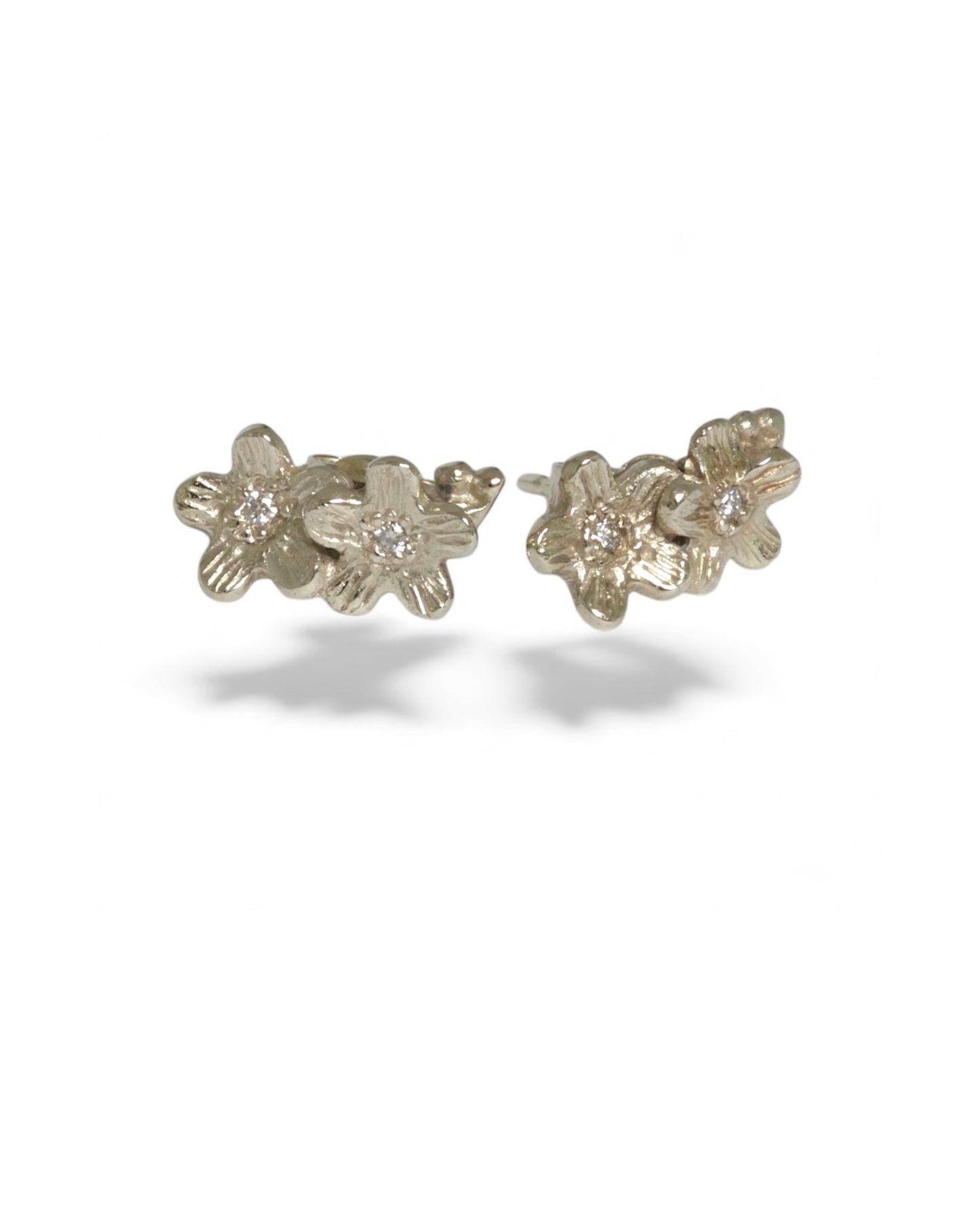 9 carat white gold diamond stud flower earrings