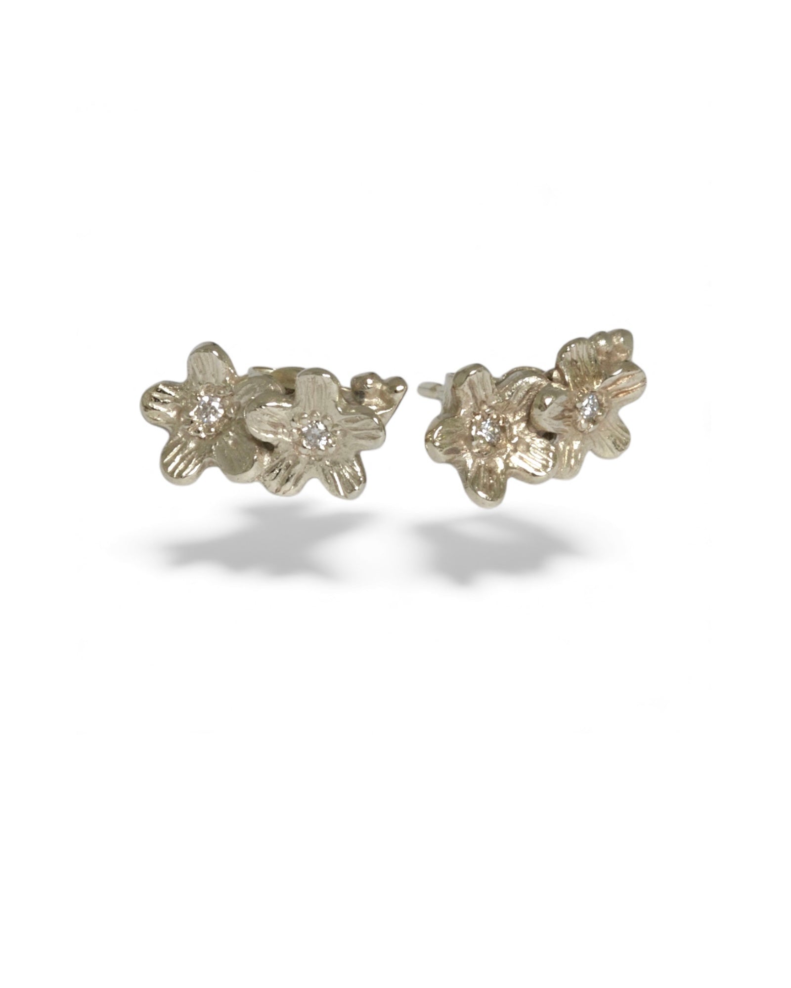 9 carat white gold diamond stud flower earrings