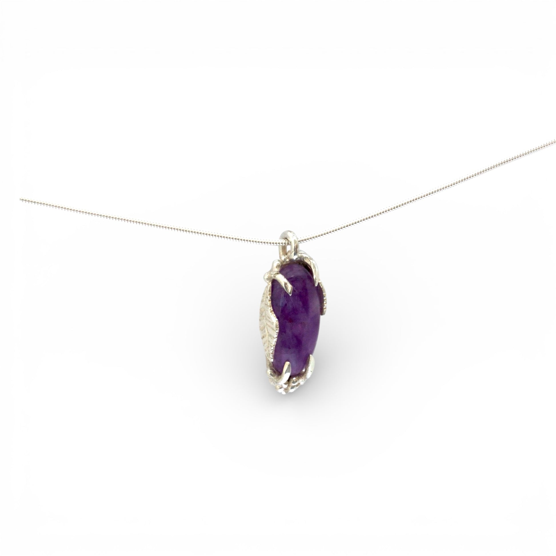Hand carved sterling silver pendant with long oval cabochon amethyst, nature inspired twig and leaf setting on silver snake chain
