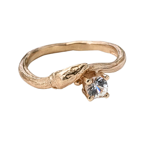 Cast from a real willow twig, showing the willow bud and bark details, this nature inspired twig ring is set with a brilliant cut natural sapphire. 