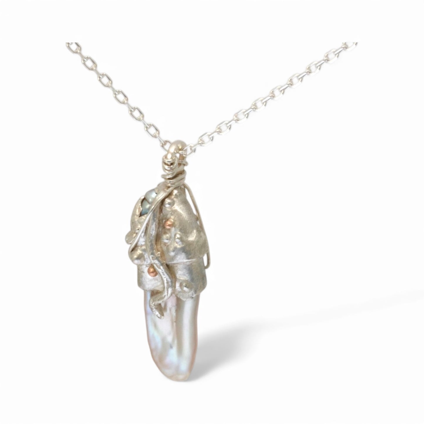 Keshi pearl set in sterling silver with rose gold.