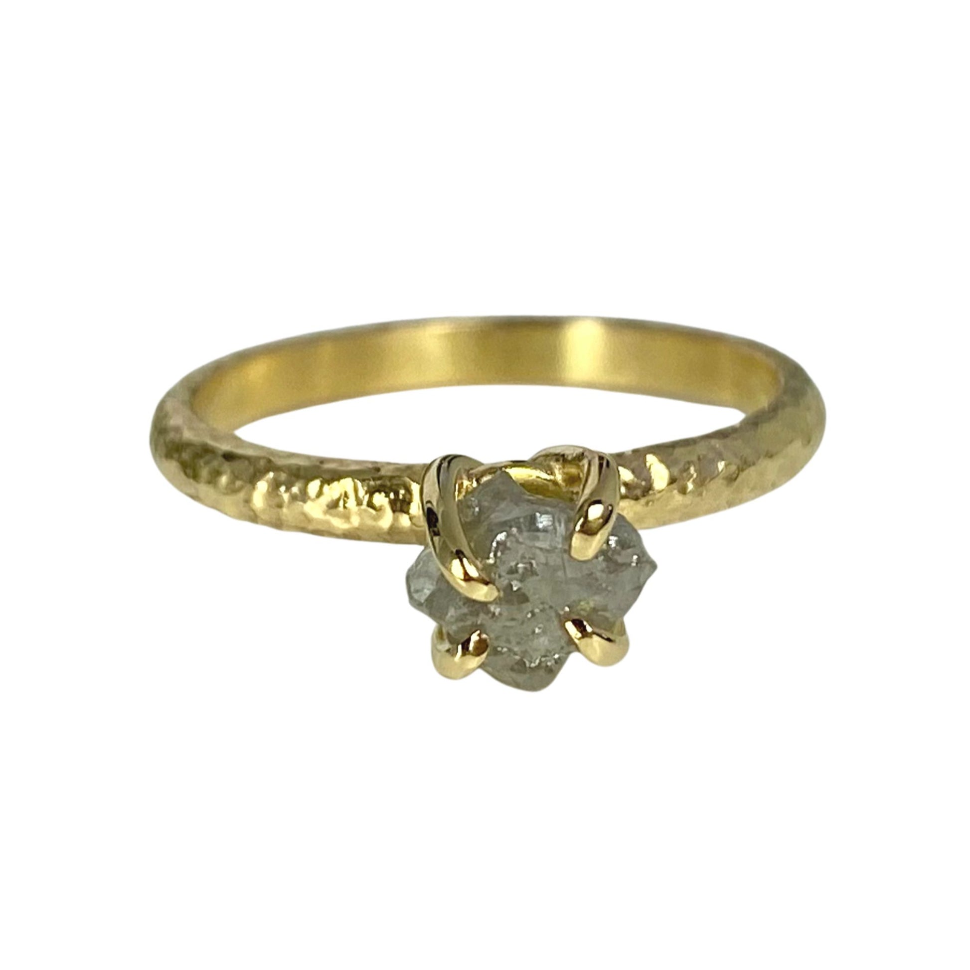 textured 18ct yellow gold engagement ring with a claw set natural rough uncut grey diamond.