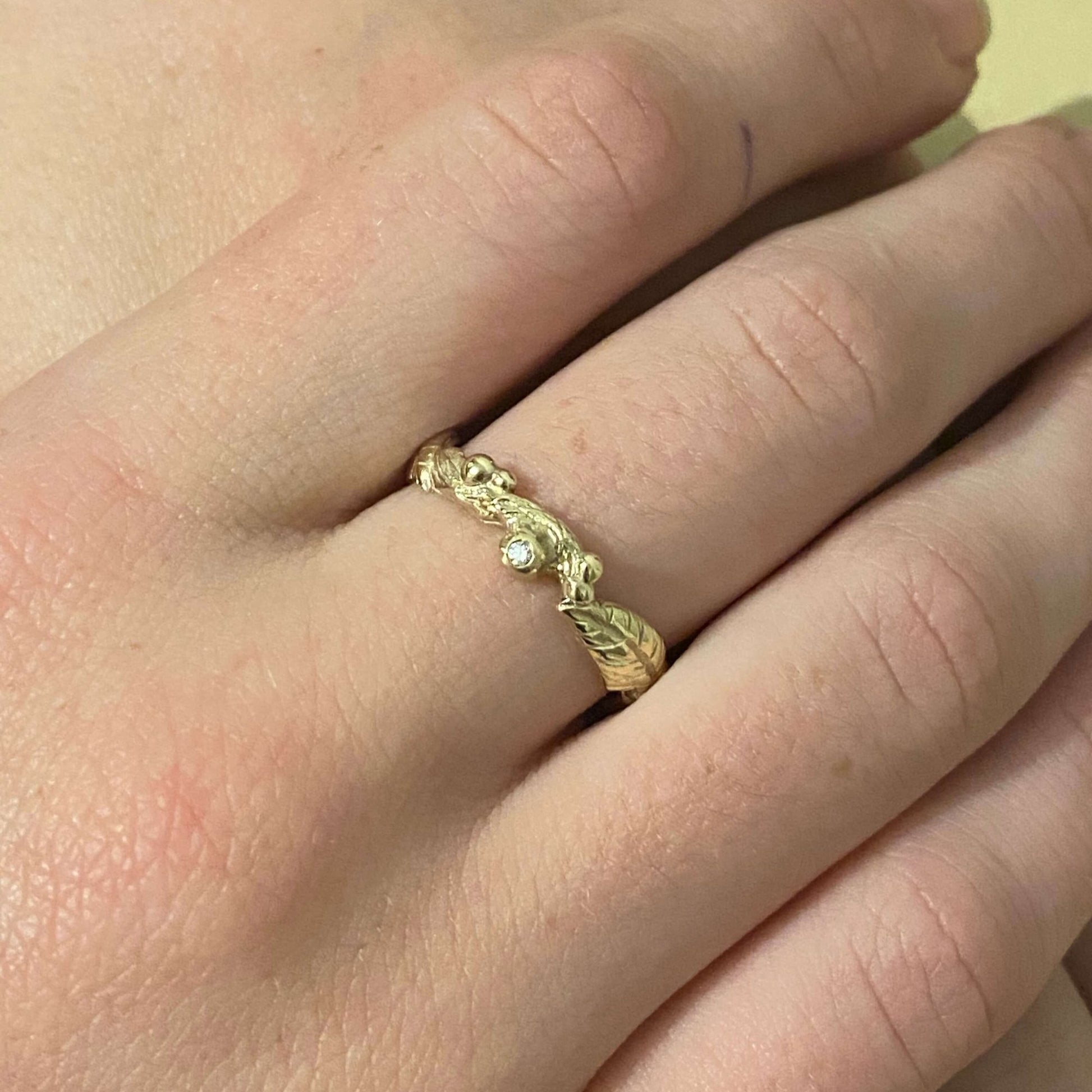Nature inspired 9ct gold leaf ring, a carved woodland ring with twigs, leaves and berries and studded with champagne, white and salt and pepper natural diamonds. For nature lovers and woodland weddings.