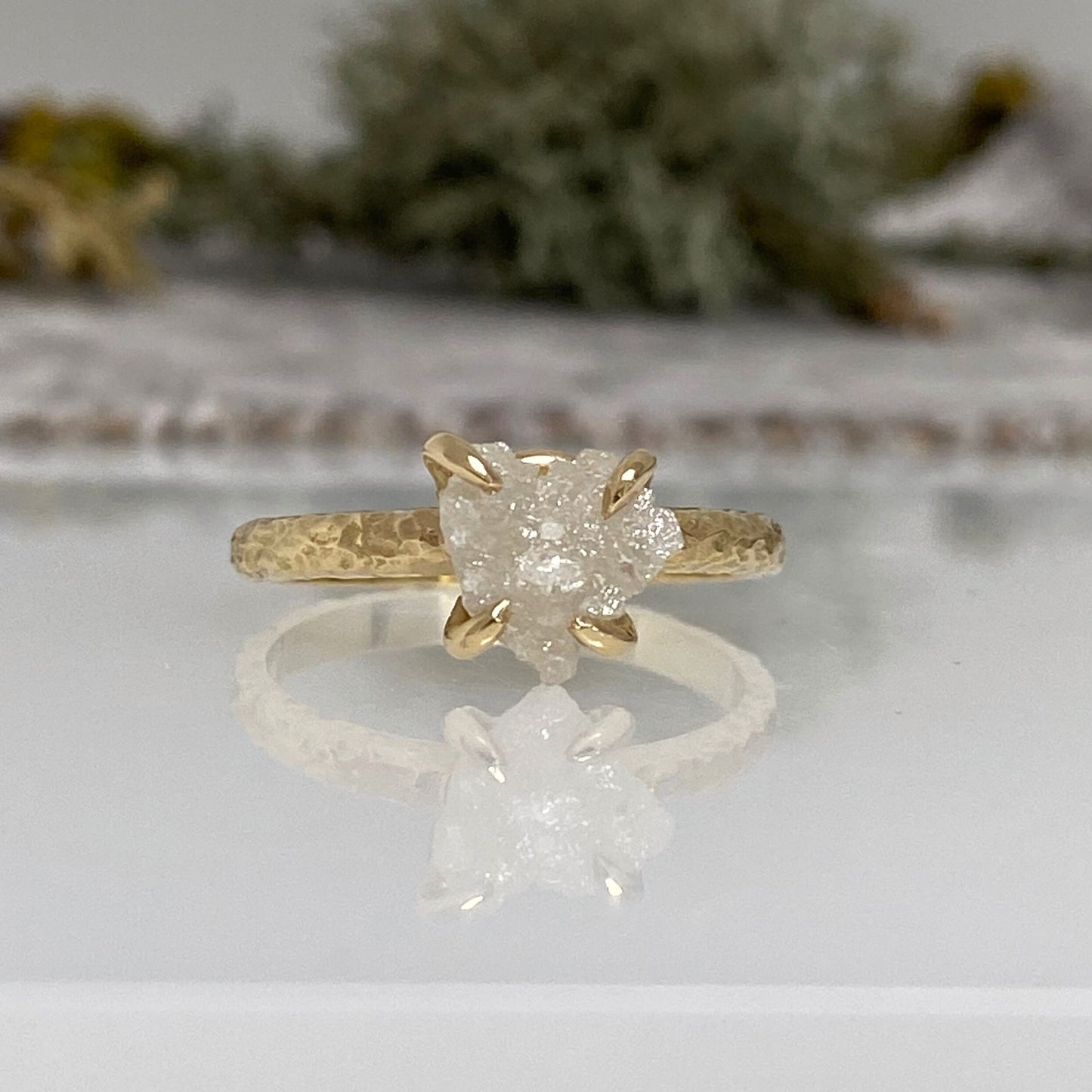 textured 18ct yellow gold engagement ring with a claw set natural raw uncut diamond.
