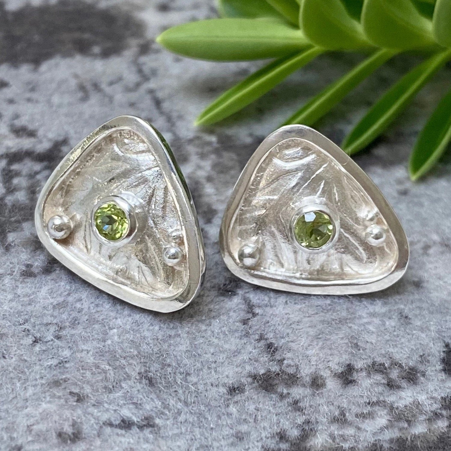 silver studs with peridot